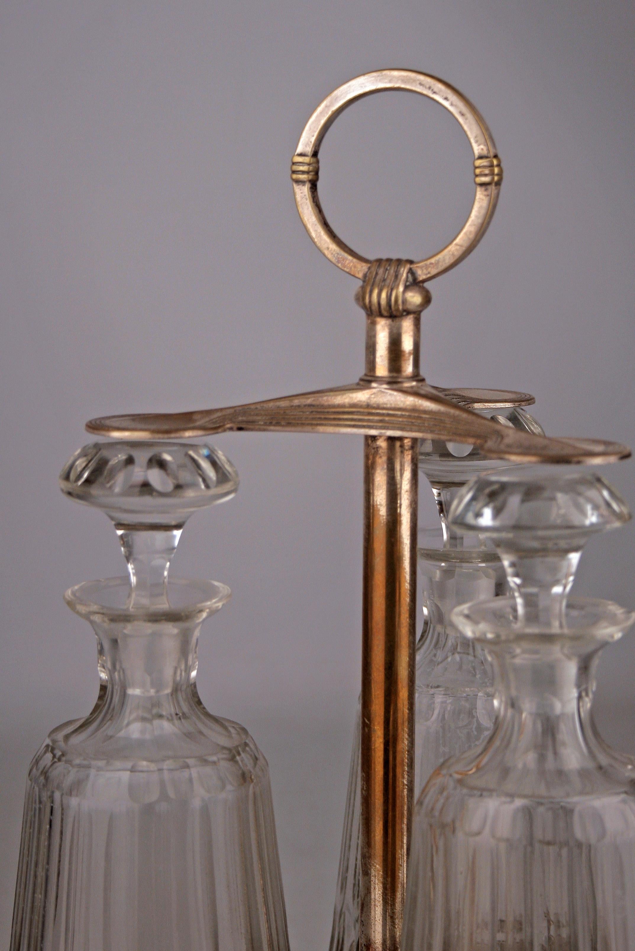 Metalwork Jugendstil Set of Silver Tantalus and Three Glass Decanters with Stoppers by WMF For Sale