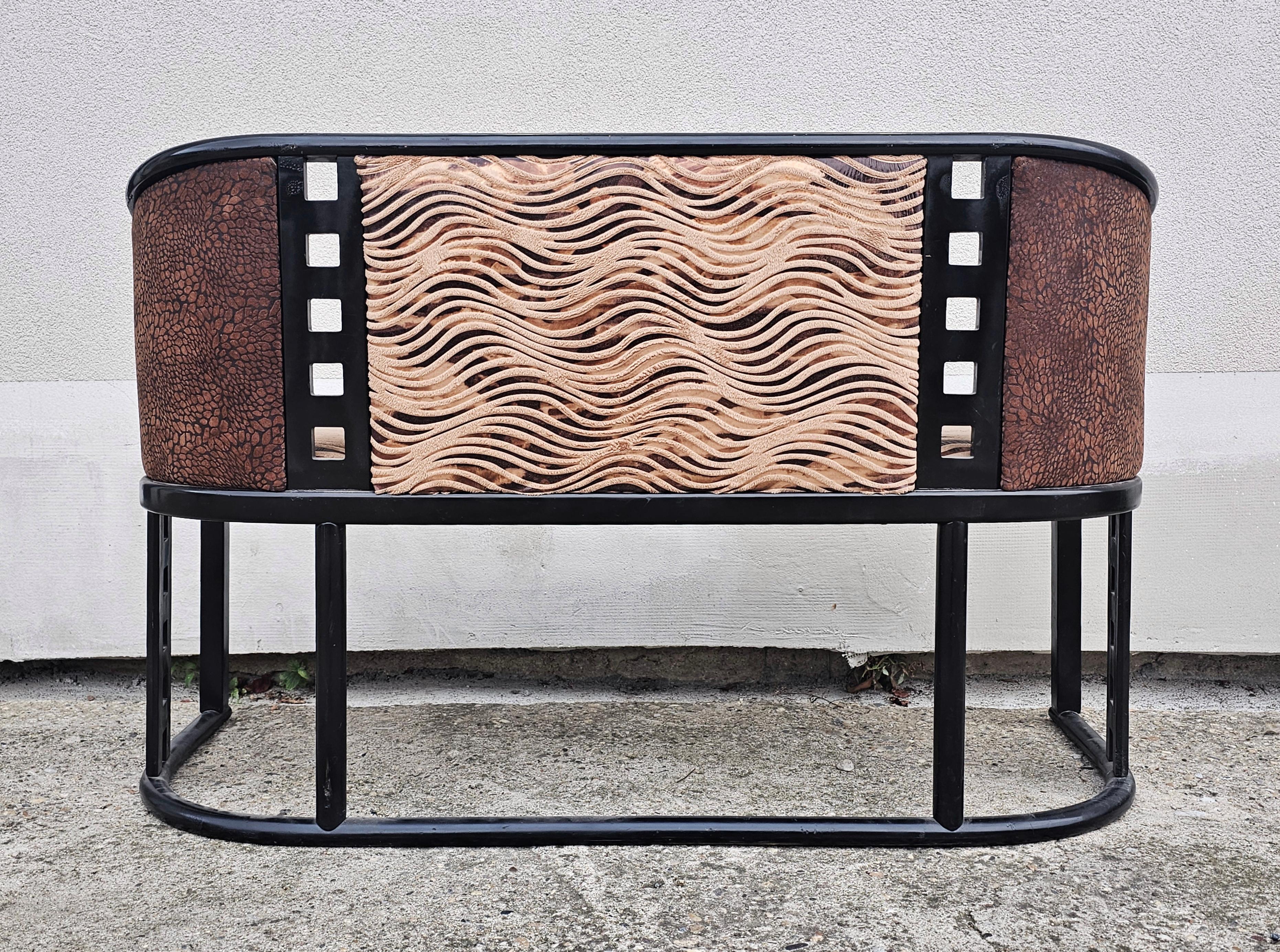 In this listing you will find a beautiful Jugendstil Settee done in beech bentwood. It is designed in style of Josef Hoffmann, featuring sleek lines typical for his work. The settee has been reupholstered by the previous owner in animal print