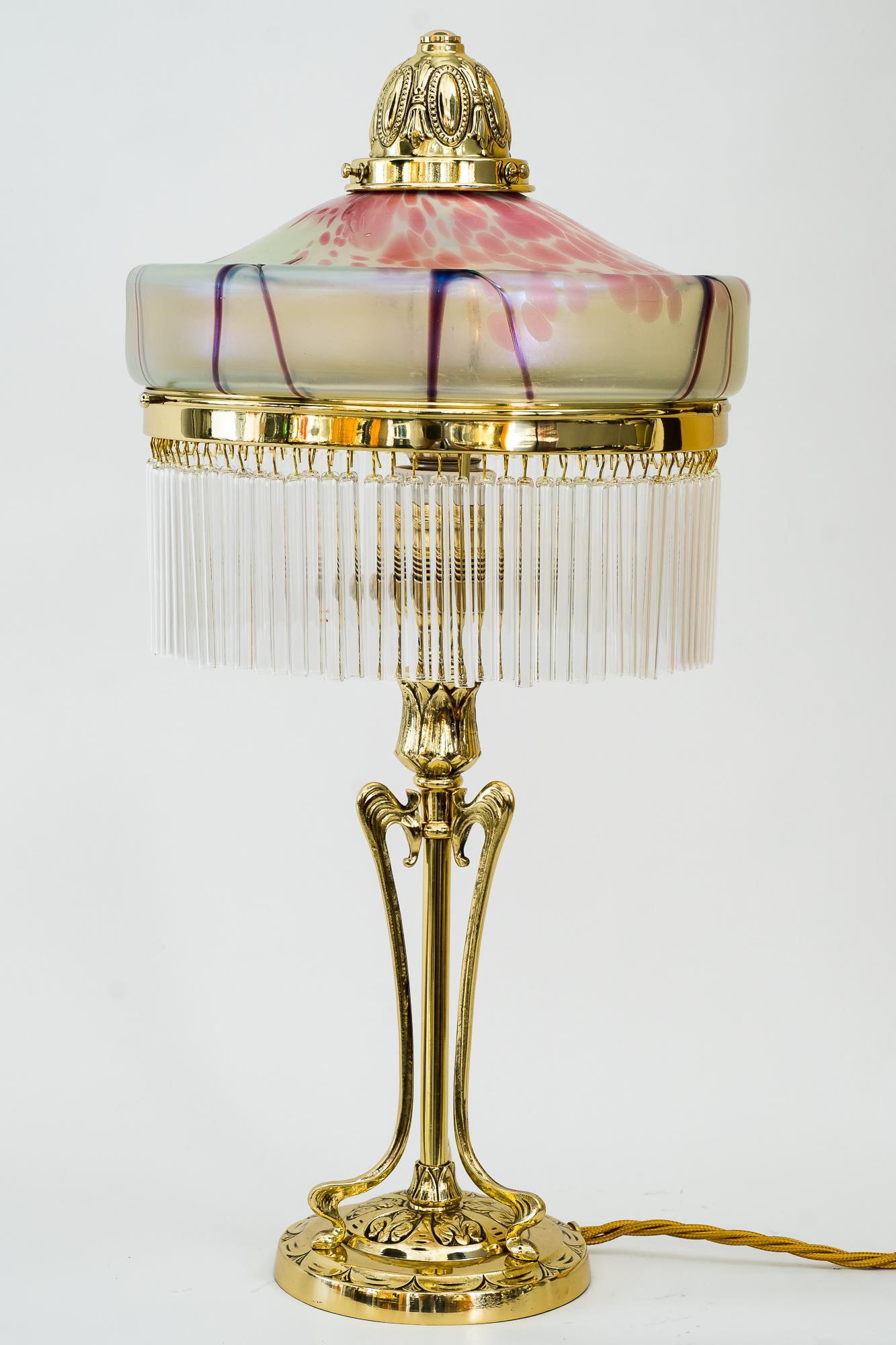 Jugendstil table lamp around 1908 with original palme koenig glass shade
Brass polished and stove enamelled
Glass sticks are replaced ( new ).
 