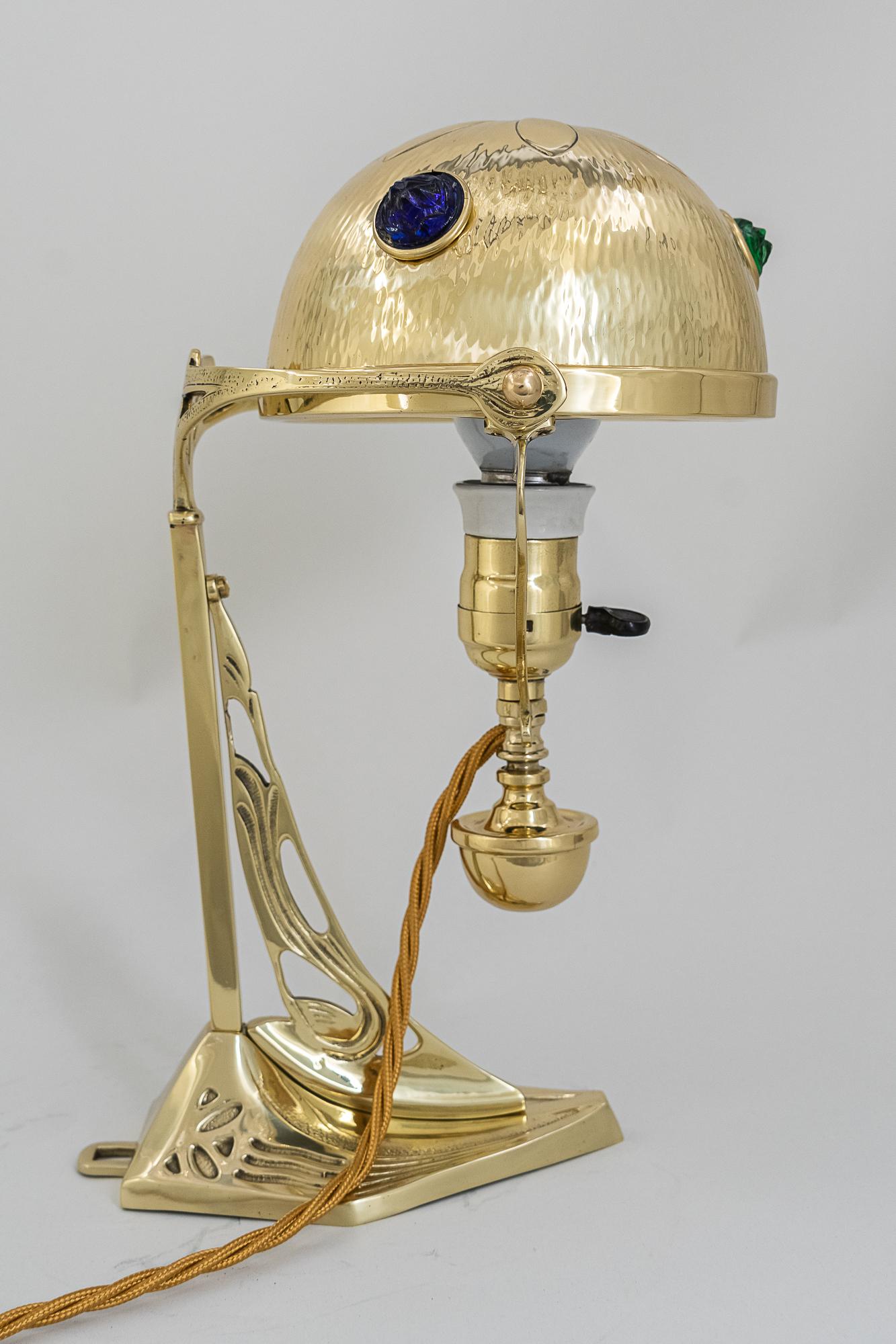 Jugendstil table lamp, Vienna, circa 1909.
Polished and stove enameled
Opaline glass stones.