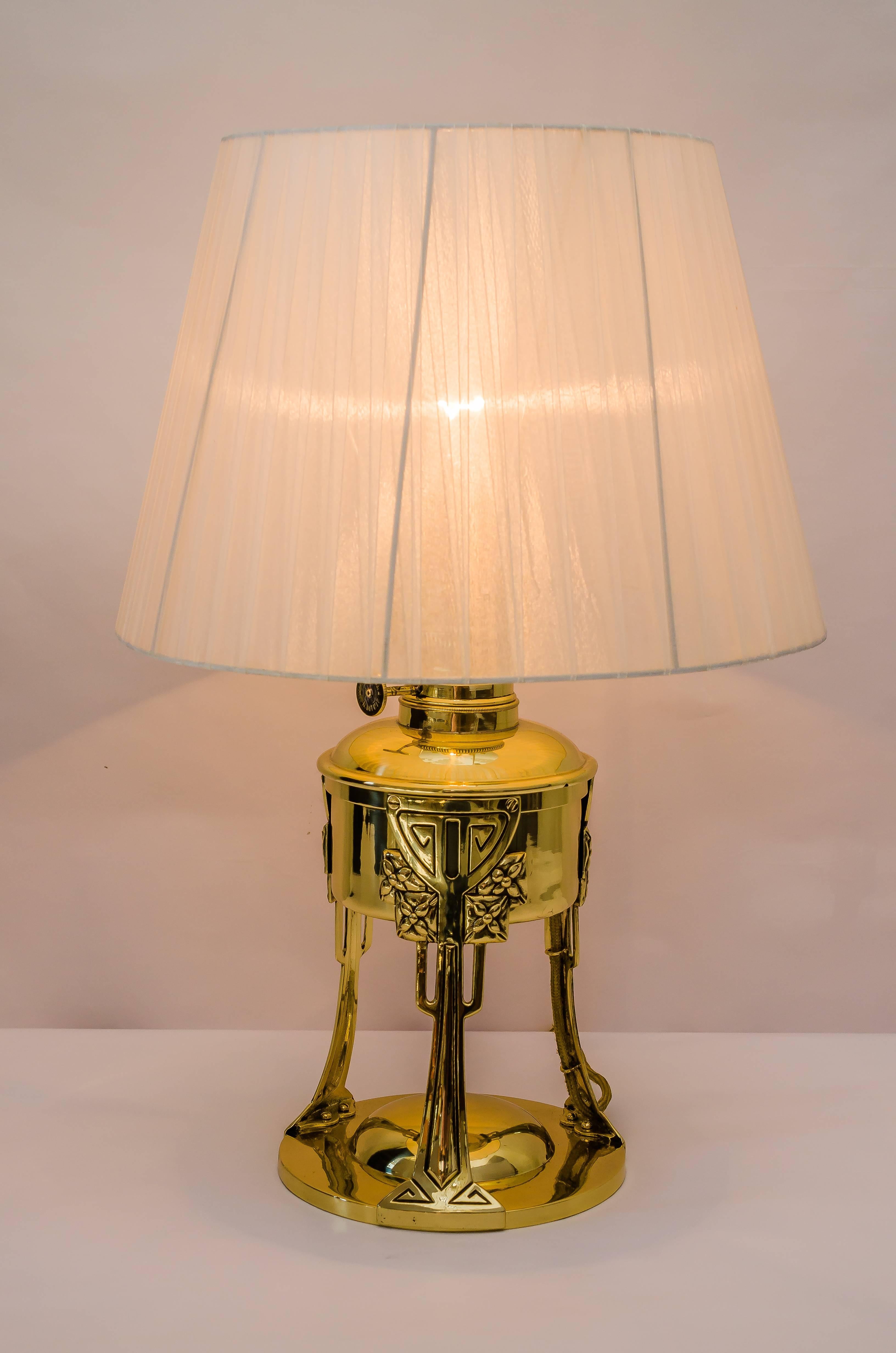 Jugendstil table lamp with fabric shade, 1907
Polished and stove enameled
Fabric shade replaced (new).
 