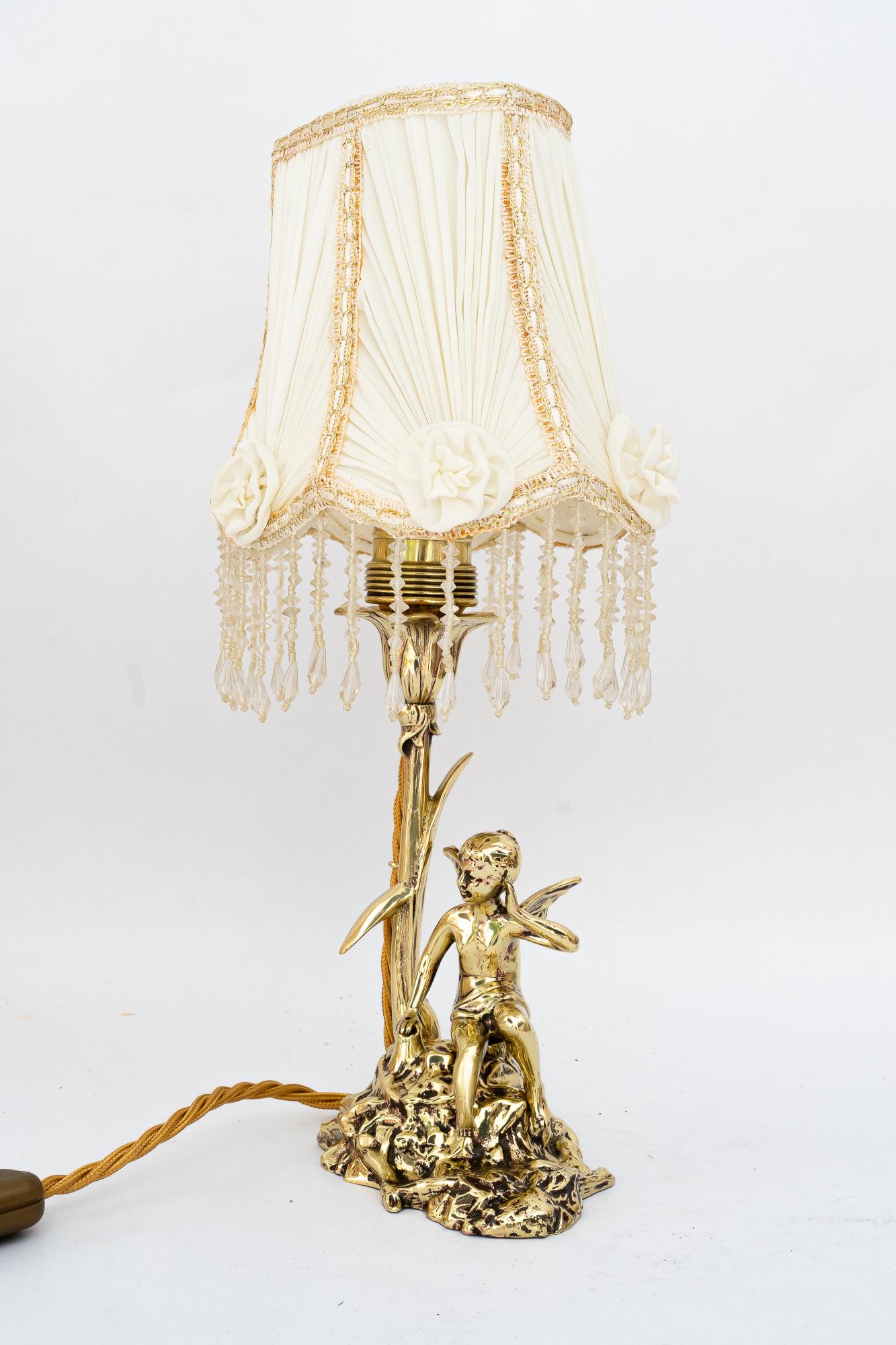 Jugendstil table lamp with fabric shade vienna around 1908
Brass polished and stove enameled
Very beautiful fabric shade