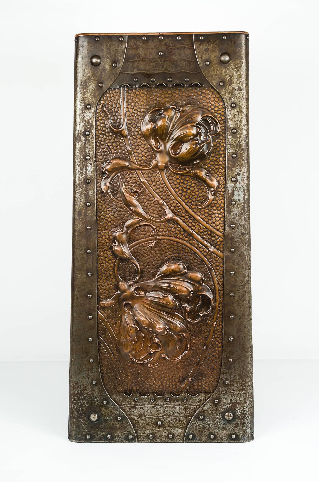 This rare umbrella stand is designed for a corner
copper and iron combination.