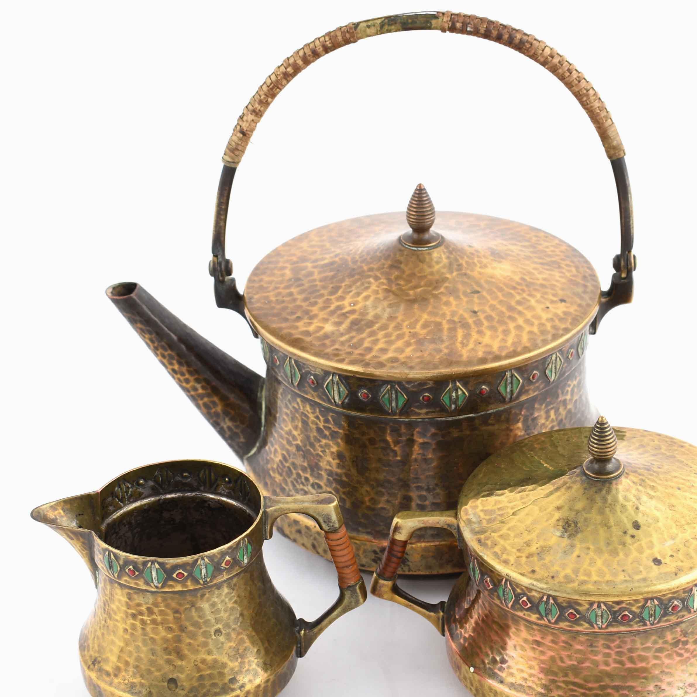 Jugendstil tea set is an original group of decorative objects realized in the 1910s.

Original decorated brass.

Realized by WMF. Made in Germany. 

The set includes: a coffee pot, a sugar bowl and a cream server.

Very good conditions.
