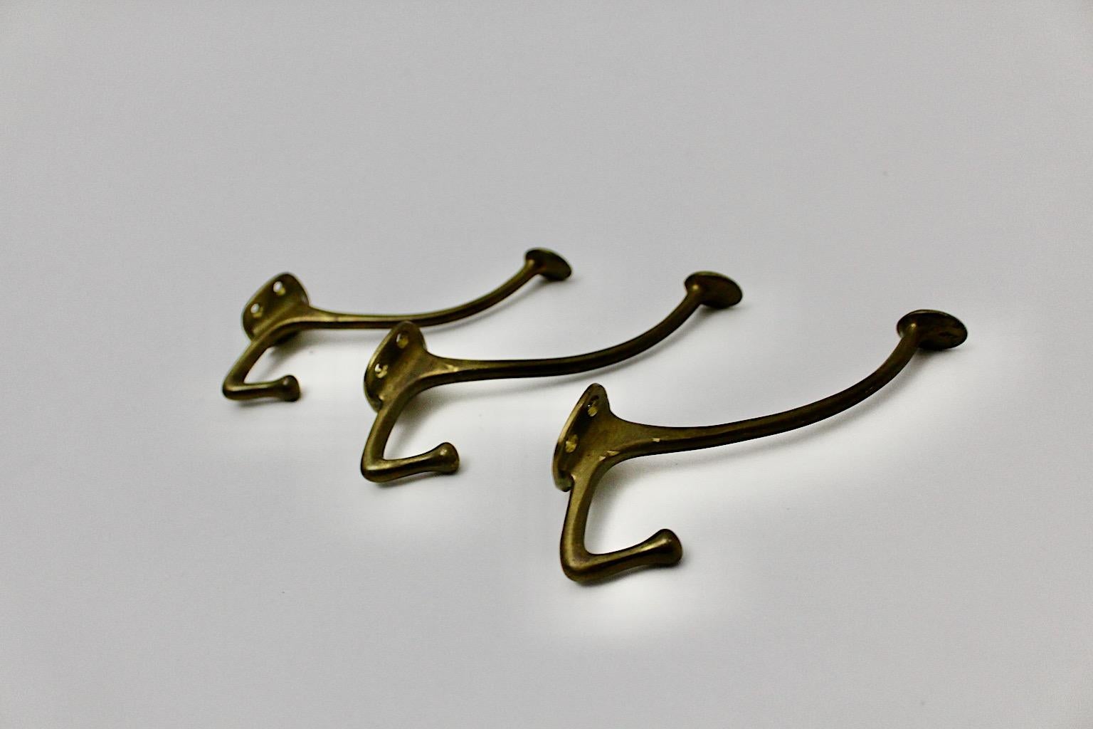 Jugendstil vintage three wall hooks from brass designed by Adolf Loos for the Cafe Capua Vienna 1916.
The brass wall hooks feature timeless and iconic design and are easy to fix with screws.
Very good condition with beautiful patina
approx.