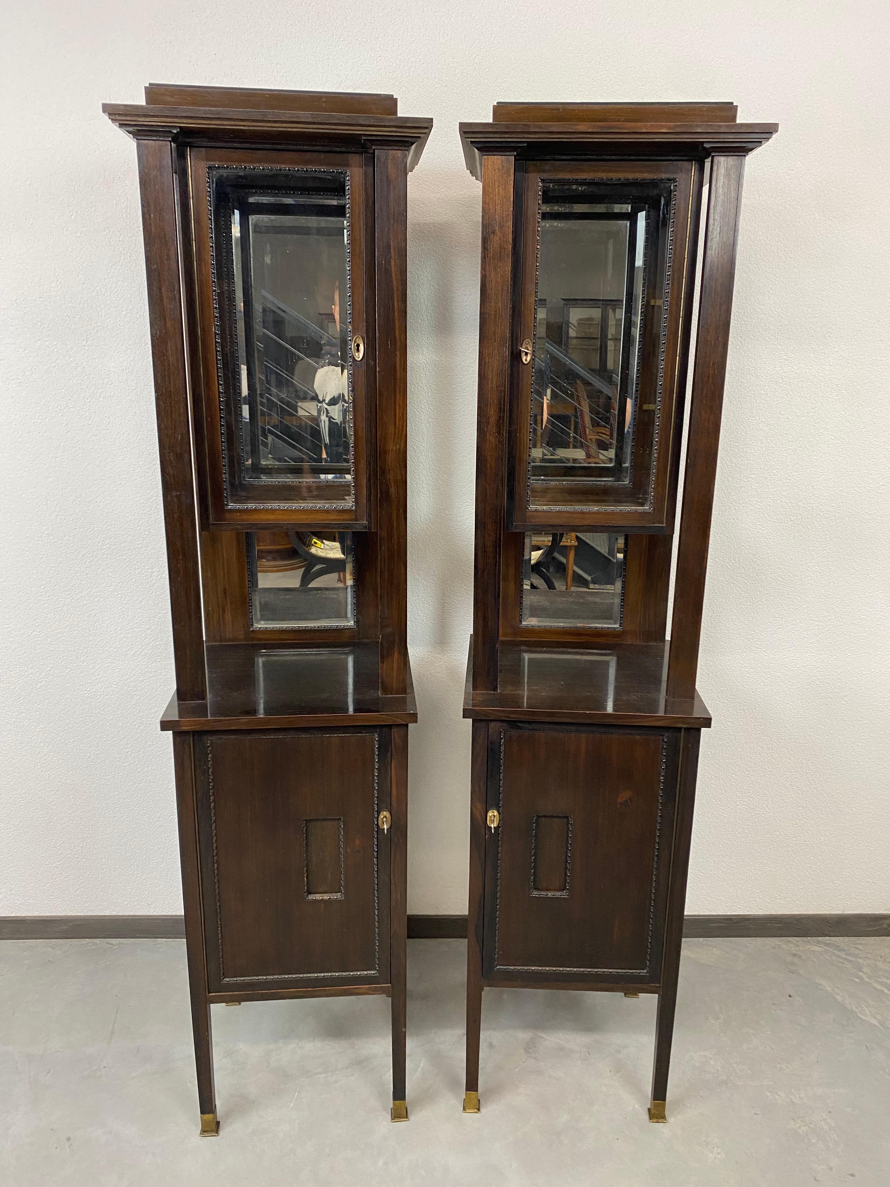 Pair of jugendstil vitrines in style of Adolf Loos in original condition with slight signs of usage. Brass leg endings.