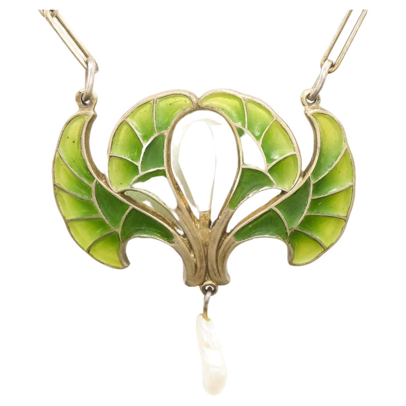 Exquisite in both design and color, this marvelous Jugenstil (Art Nouveau) necklace was made in Pforzheim, Germany by Heinrich Levinger, who founded his business in 1878.

Finely made of .900 silver (just under our US .925 sterling standard of