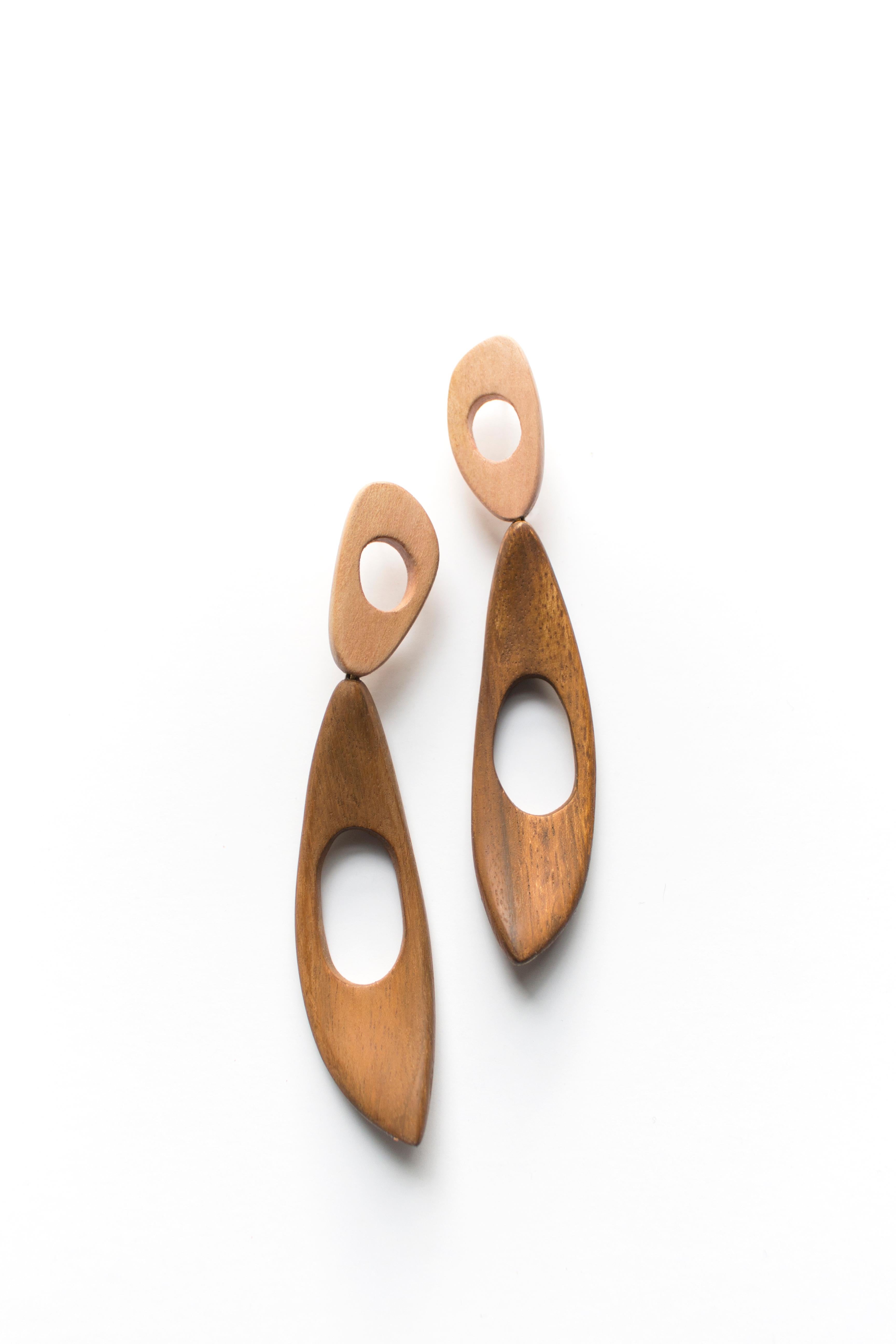 Long wood drop earrings inspired by the mid-century surfboard aesthetic.  Hand carved amoebic birch studs paired with large dangling sculpted acacia. Hypoallergenic stainless steel posts. 

All Hola Luna pieces are handcrafted one-off designs made