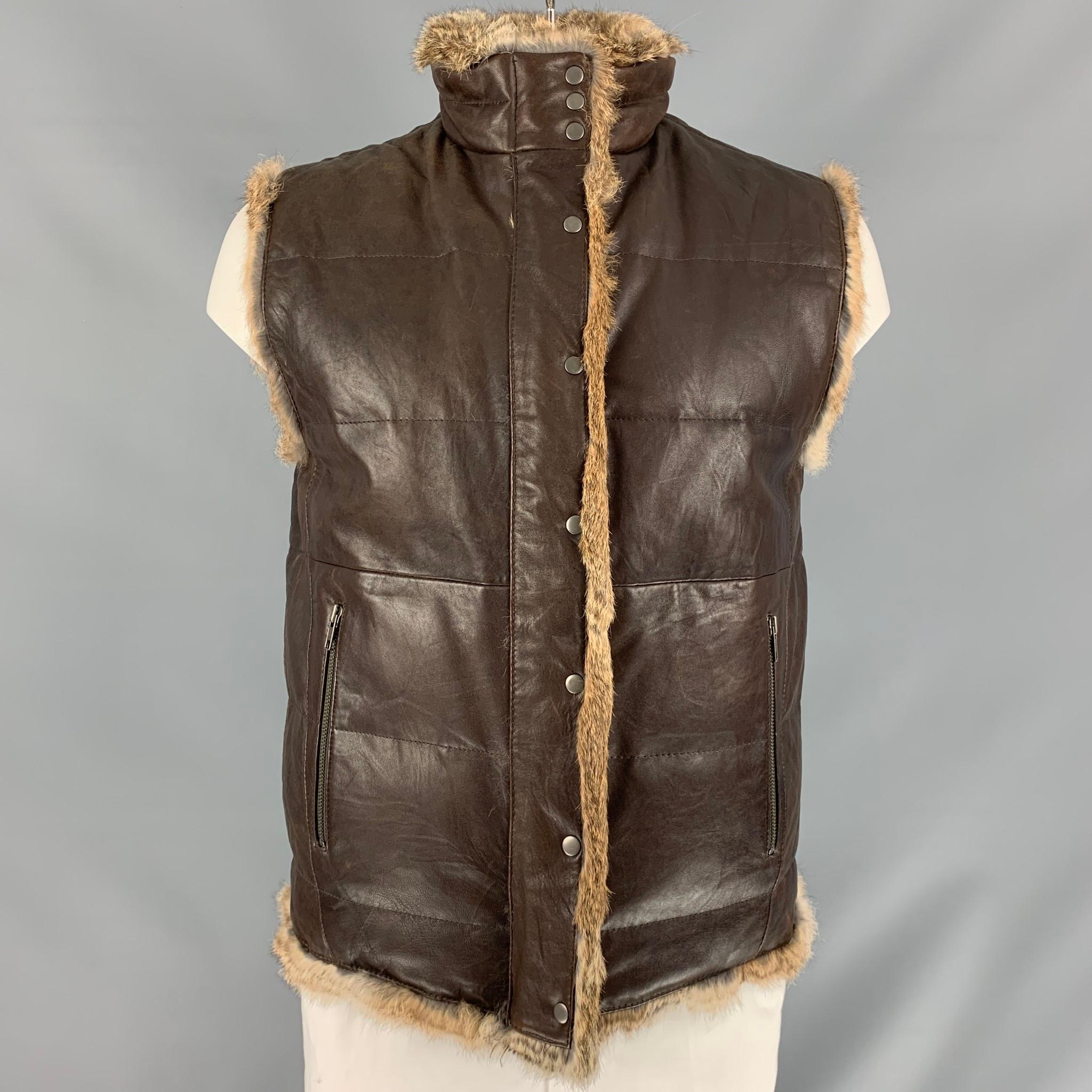 JUICY COUTURE reversible outerwear vest comes in brown leather and rabbit fur featuring a mock neck, two zipper pockets at front and zip up closure. 

Excellent Pre-Owned Condition.
Marked: L

Measurements:

Shoulder: 18 in
Chest: 44 in
Length: 30