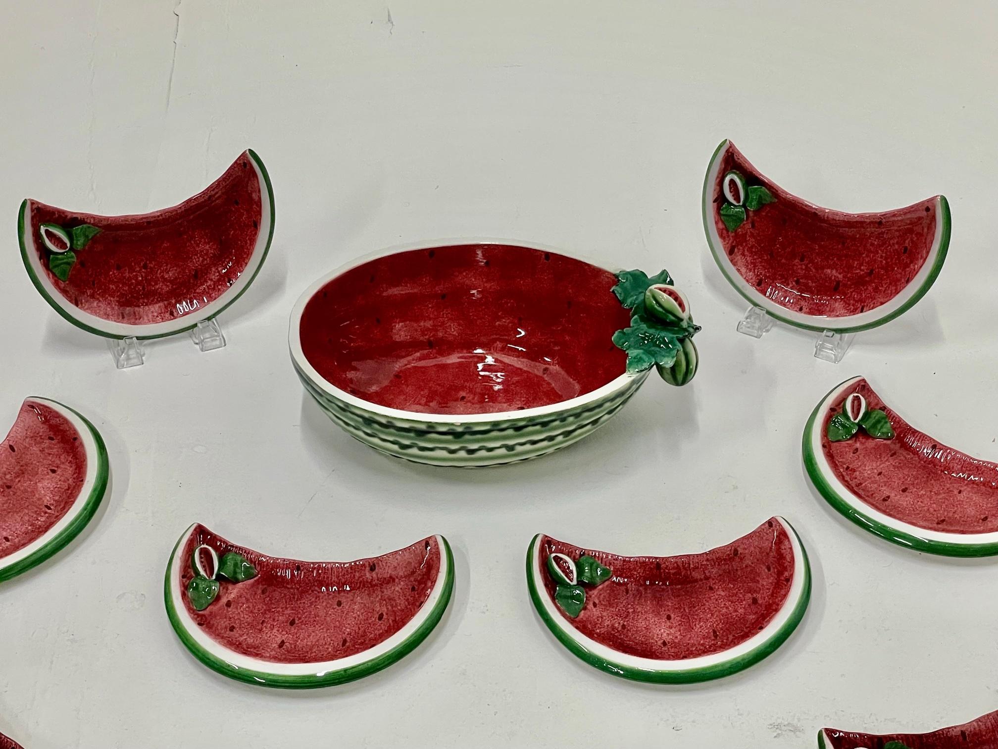 Whimsical and fun set of 12 watermelon motife plates and a matching serving bowl from Italy.
Plates are 9.5 W 6 D 1 H
Bowl 15 W 10 D 5 H.