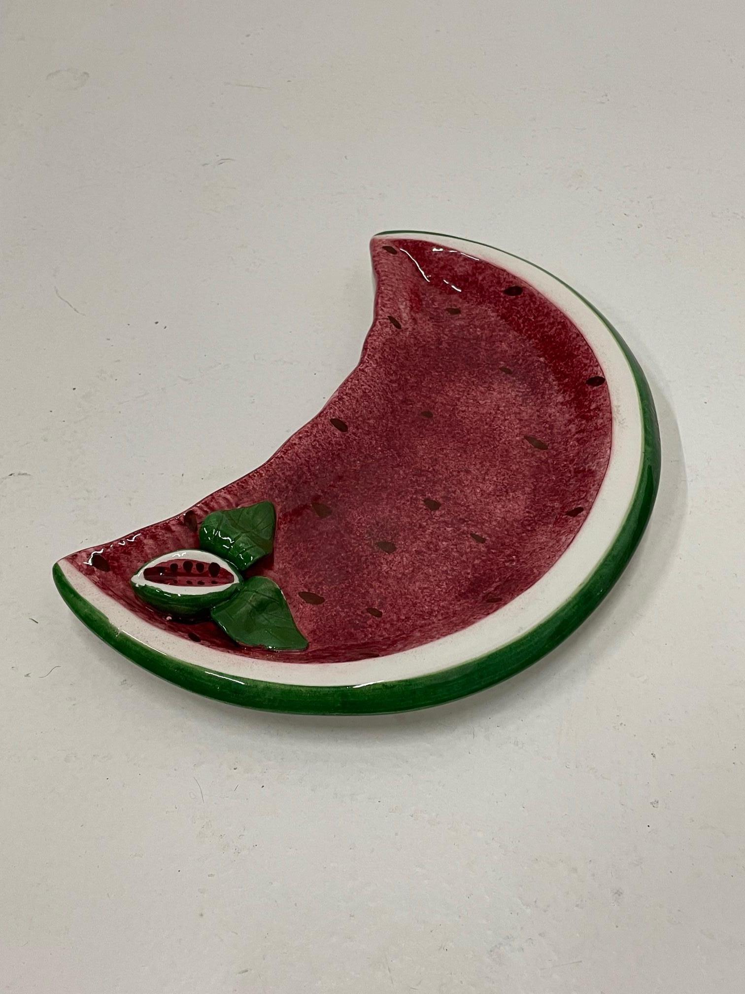 a watermelon is blown into three pieces