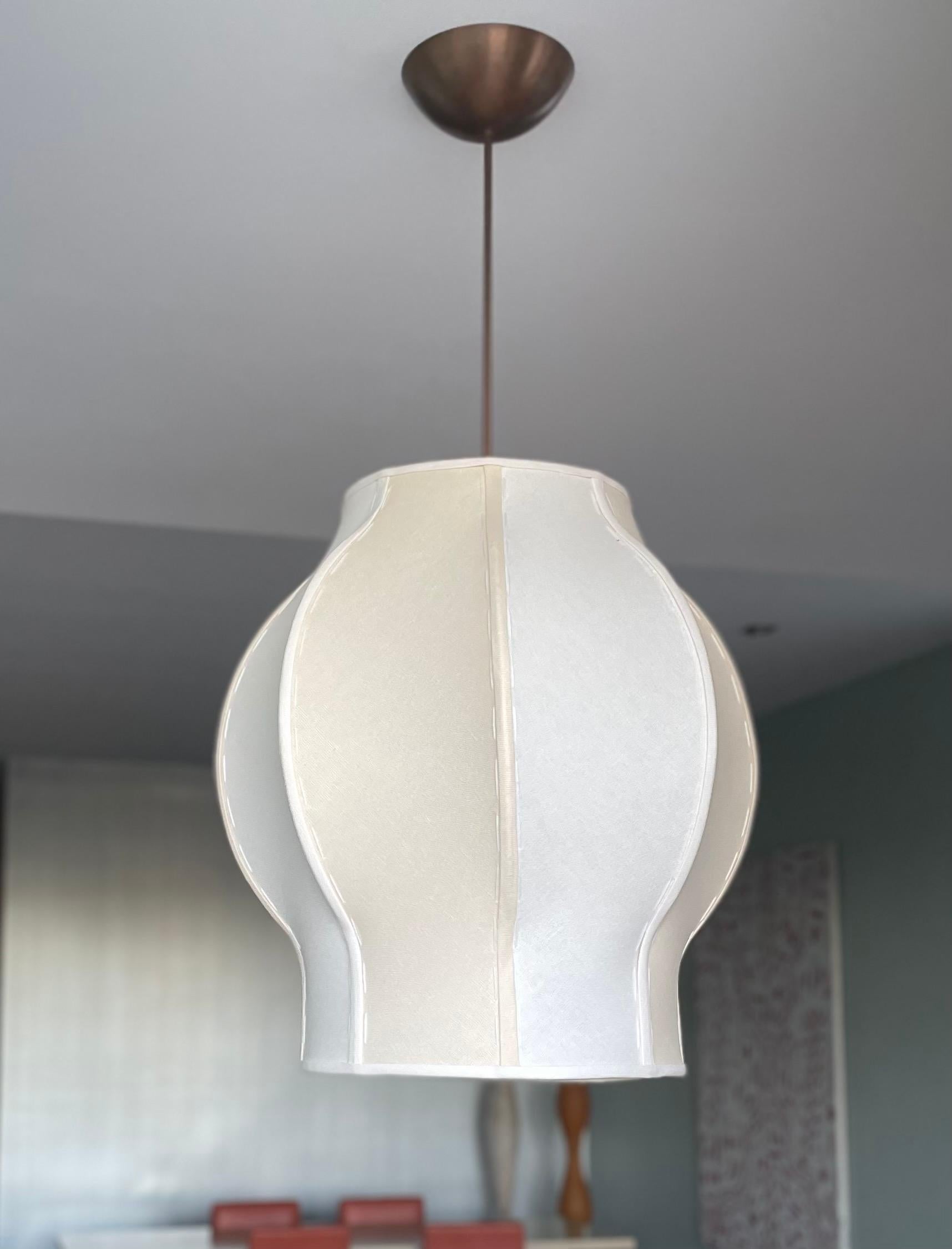 Jules is a graceful handmade 2-tone pendant light with a soft organic shape reminiscent of a translucent jelly fish. It can also be used as a modern take on Chinoiserie or Hollywood Recency depending on the choice of fabrics and metal finishes you