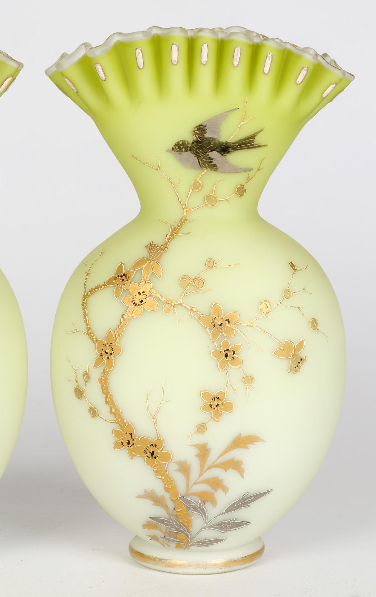 A very fine and stunning pair late Victorian satin green glass vases with floral and bird designs attributed to Jules Barbe for Thomas Webb and dating to the 19th Century. The hand blown vases are of rounded flask shape with fan shaped tops with