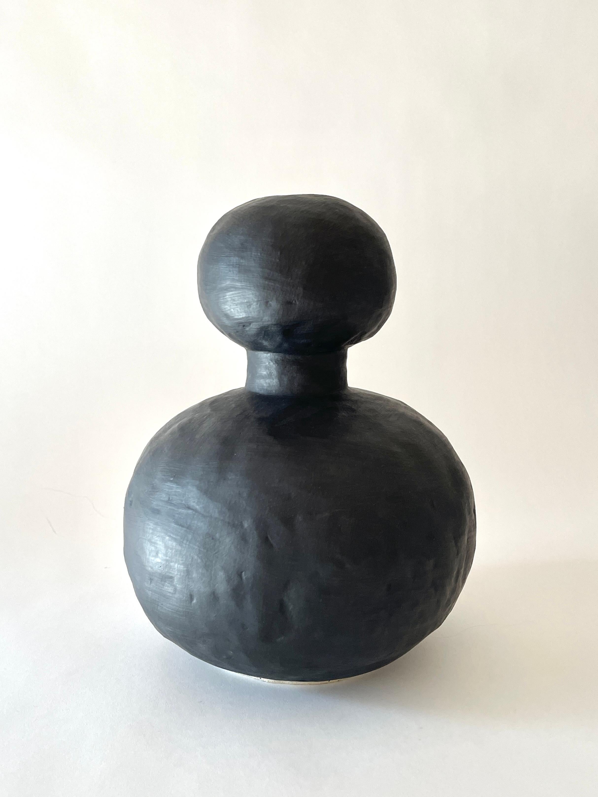 Jules Black vase by Meg Morrison
Materials: Ceramic.
Dimensions: Ø 23 x H 32 cm.

Available in black, white, yellow and pink finishes. All sizes are approximate. Although vases are watertight condensation may form on the bottom. Please protect