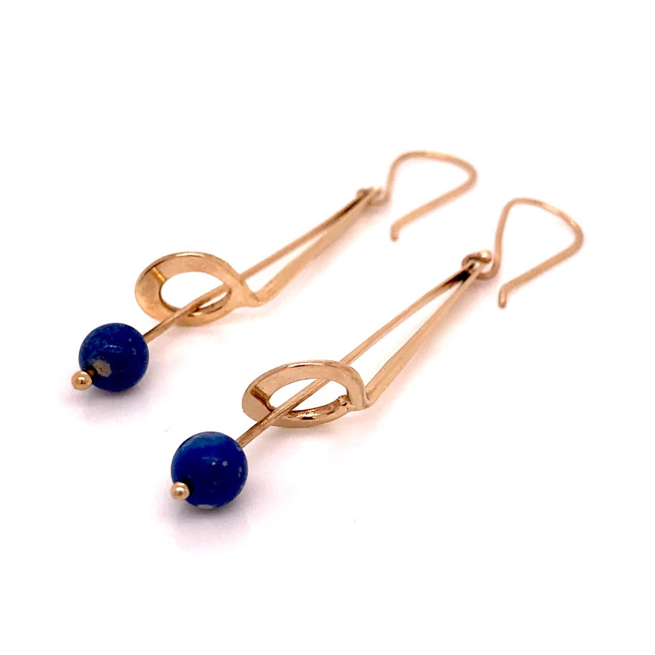 A beautiful pair of earrings by the American modernist Jules Brenner.

Each in 14k gold with a fishhook ear wire and a suspended lapis bead.

Jules Brenner was an important jeweler in the American Modernist jewelry movement. He worked with Ed Wiener