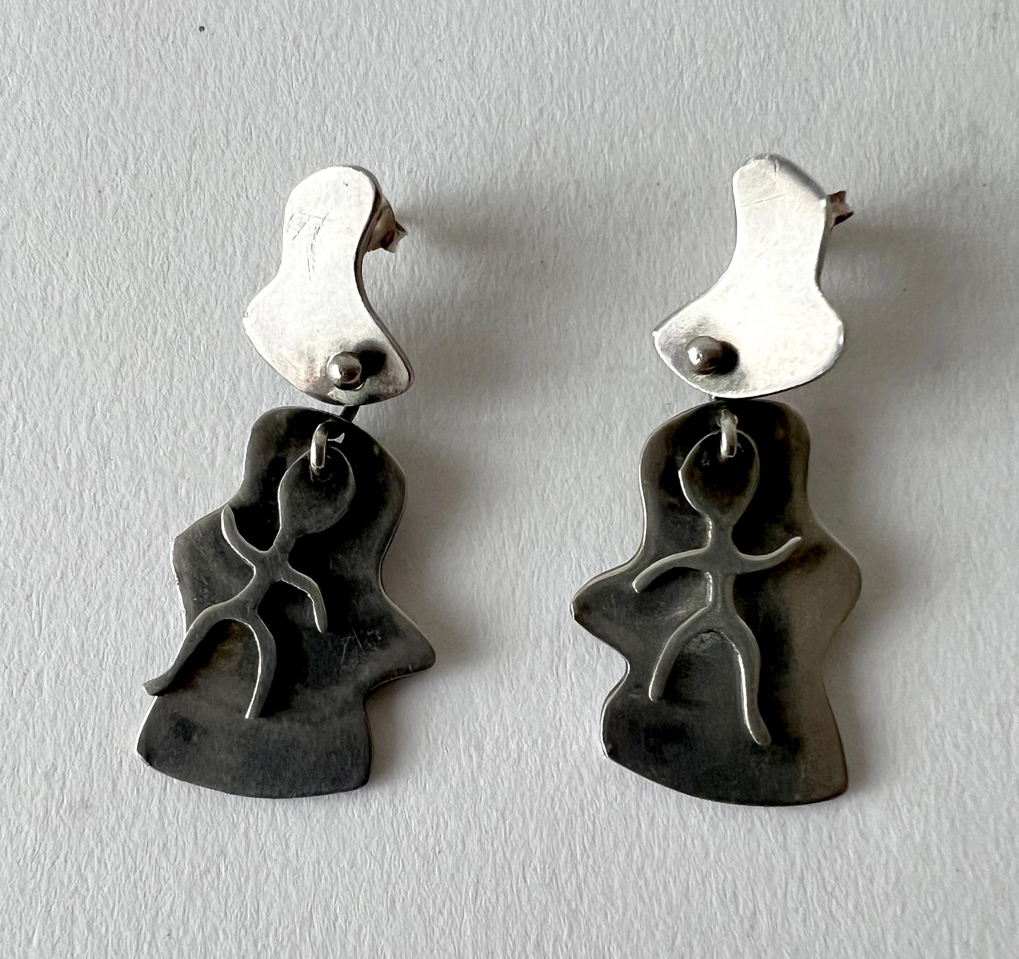 Kinteic dancer sterling silver earrings created by American modernist jeweler Jules Brenner, circa 1950's. Earrings are of the pierce variety and measure 1.75