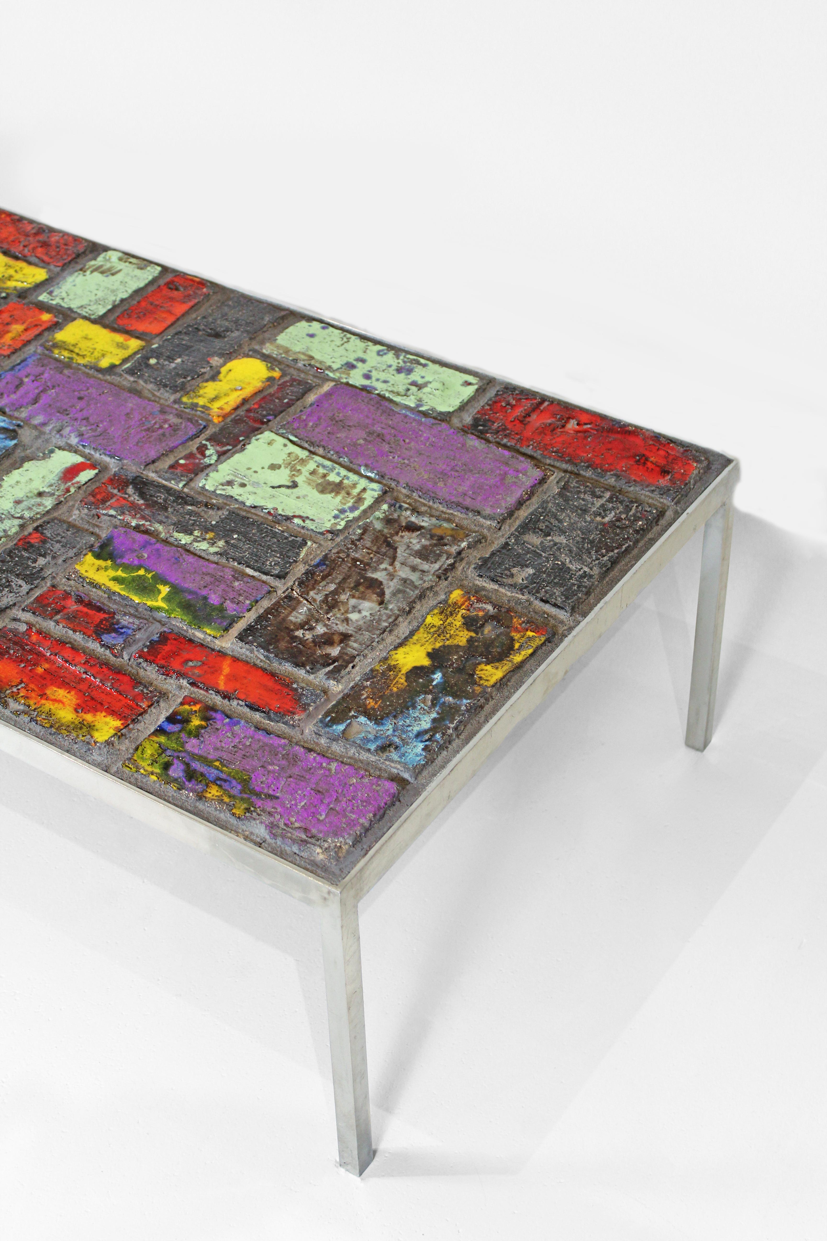 This piece presents a striking statement that fuses Brutalism and Modernism. Attributed to Belgian designer, Jules Dewaele, created this vibrant ceramic table at his workshop Pia Manu (“a creative hand”). Dewaele had begun the 1960s working at