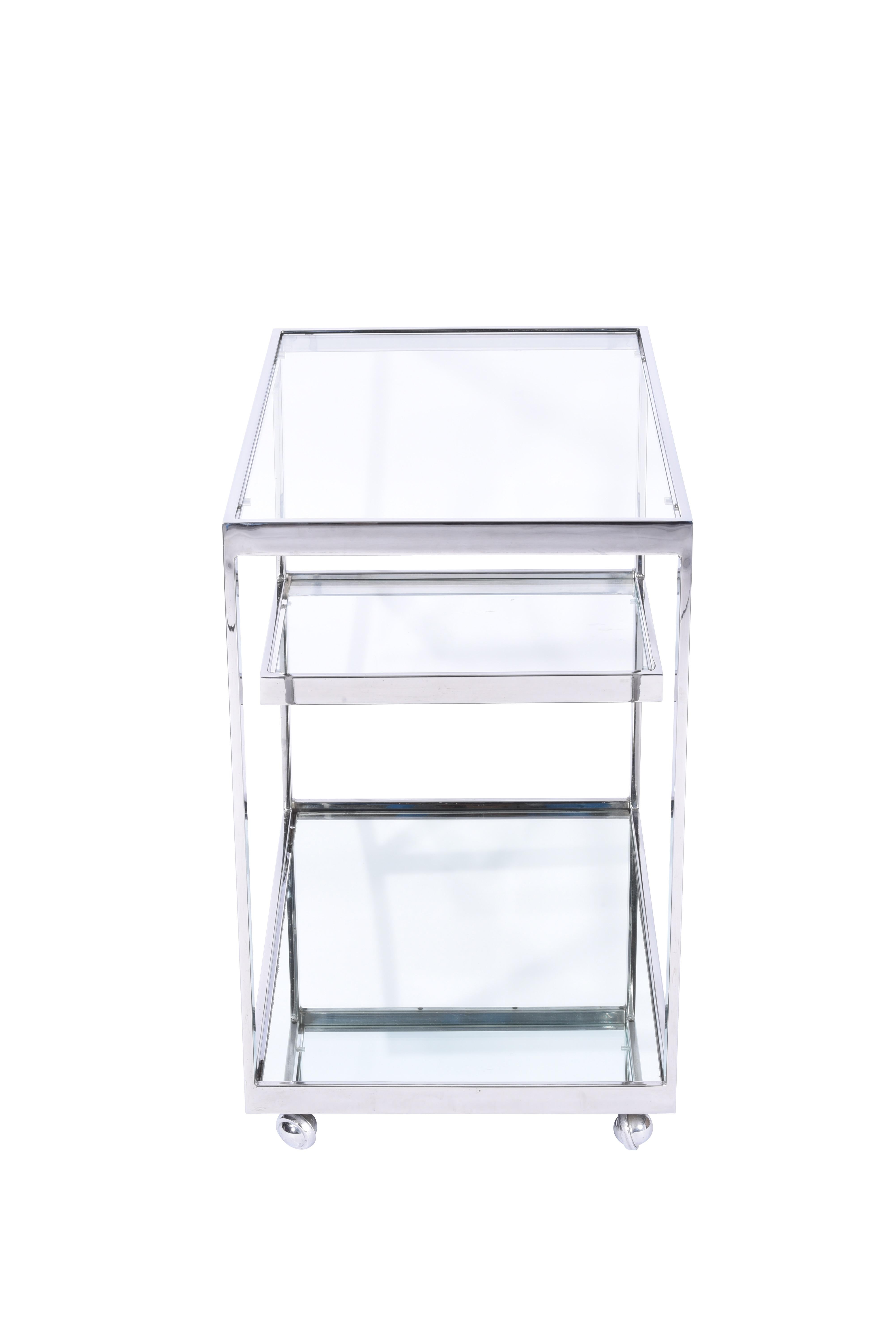 Chrome frame serving/bar cart with mirror bottom panel and glass shelves. Designed by Jules Neumann for Metropolitan, circa 1960s.