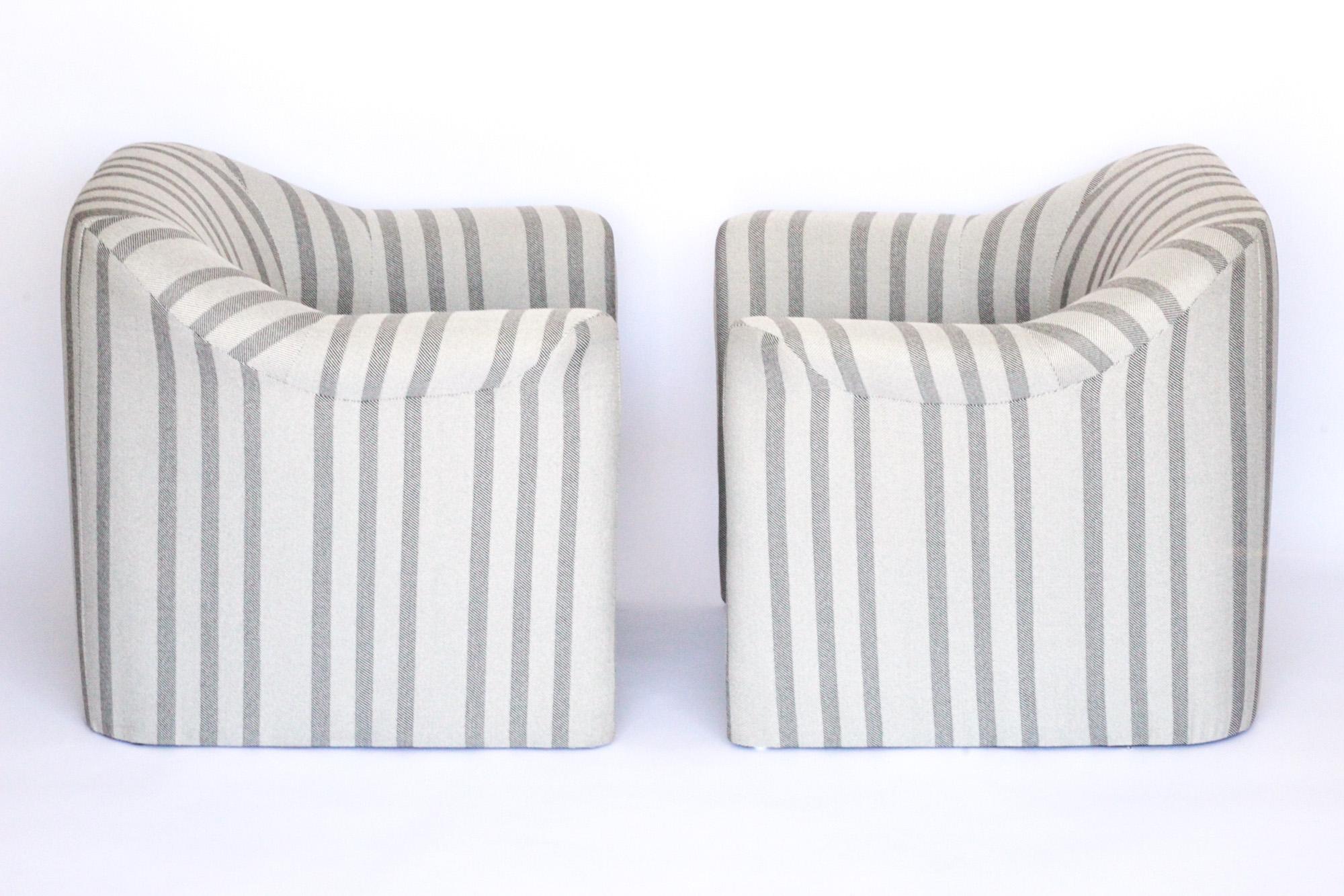 Gorgeous pair of Post-Modern lounge chairs designed by Jules Heumann in striking linear / striped black and white fabric. Jules Heumann was an incredible American Mid Century furniture designer and responsible for elevating Metropolitan Furniture