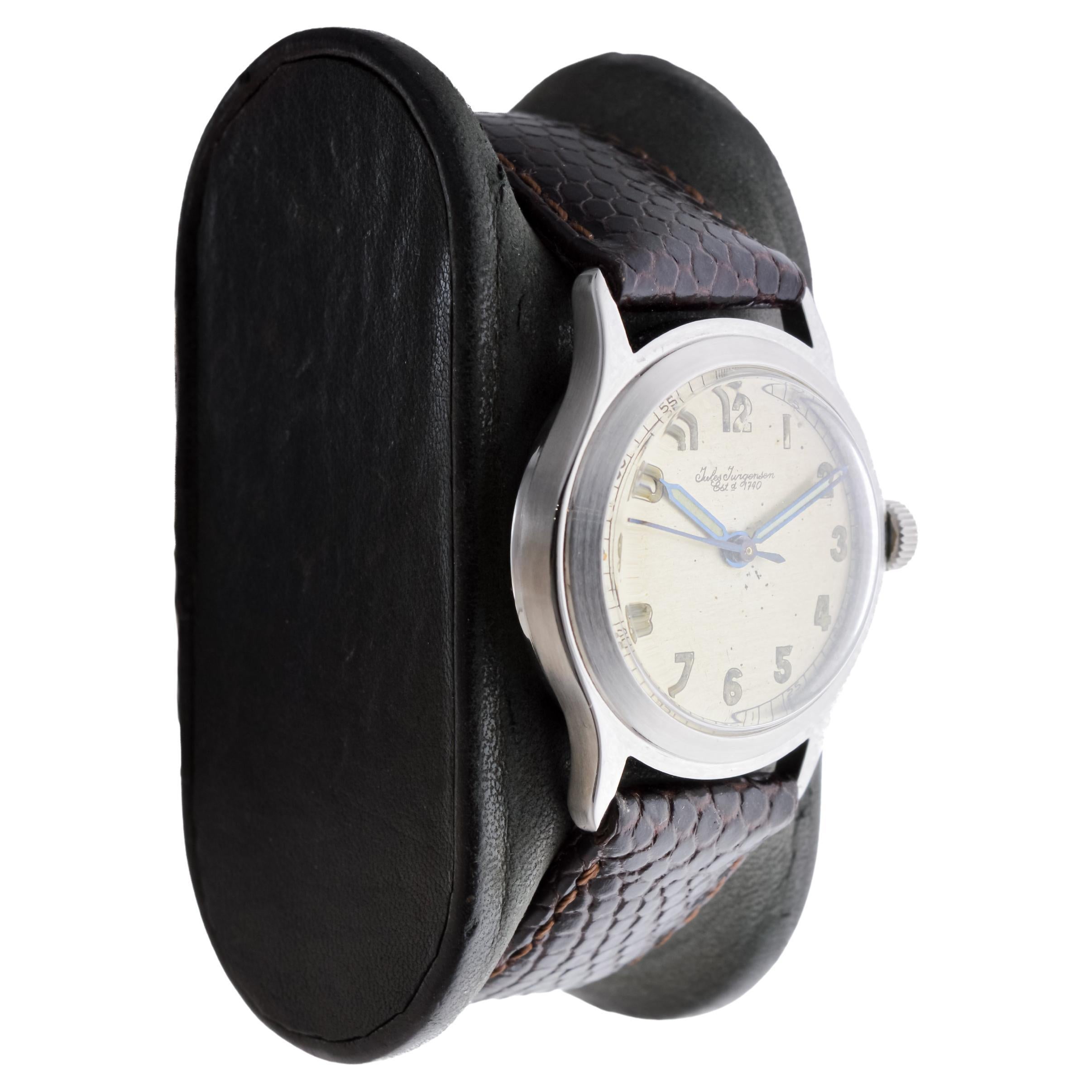 FACTORY / HOUSE: Jules Jurgensen
STYLE / REFERENCE: Round / Mid Century
METAL / MATERIAL: Stainless Steel
CIRCA / YEAR: 1940's
DIMENSIONS / SIZE: Length 36mm X Diameter 29mm
MOVEMENT / CALIBER: Manual Winding / 17 Jewels 
DIAL / HANDS: Original