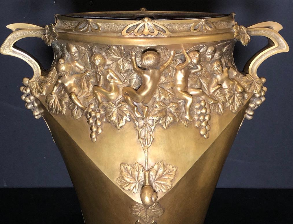 Signed Jules Jouant (1882-1921) France gilt bronze planter. Art Nouveau vase as planter with original removable copper liner. Foundry stamped Louchet, Paris. Adorned by children climbing a foliate boarder with a snail seated on a leaf at front