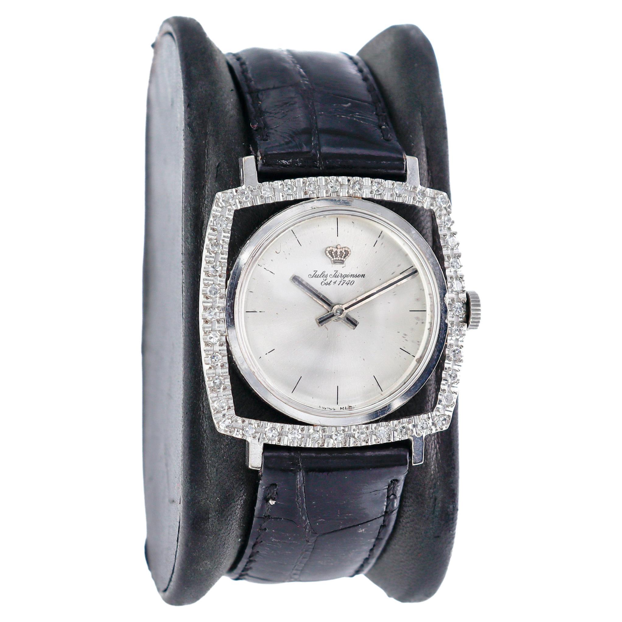 FACTORY / HOUSE: Jules Jurgensen
STYLE / REFERENCE: Mid Century / Cushion Shape
METAL / MATERIAL: 18Kt. White Gold 
CIRCA / YEAR: 1960's
DIMENSIONS / SIZE: Length 35mm X Diameter 30mm
MOVEMENT / CALIBER:  Automatic Winding /  17 Jewels 
DIAL /