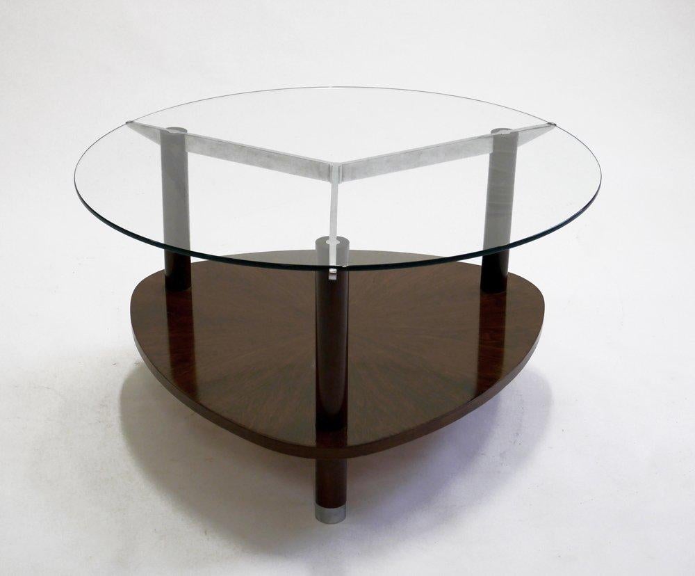 Beautiful examples of Jules Leleu timeless designs. The coffee table, circa 1930, is in mahogany, glass and nickel plated metal. It is in great condition.

Jules-Emile Leleu (1883-1961)
French sculptor and designer, Jules Leleu was born and
