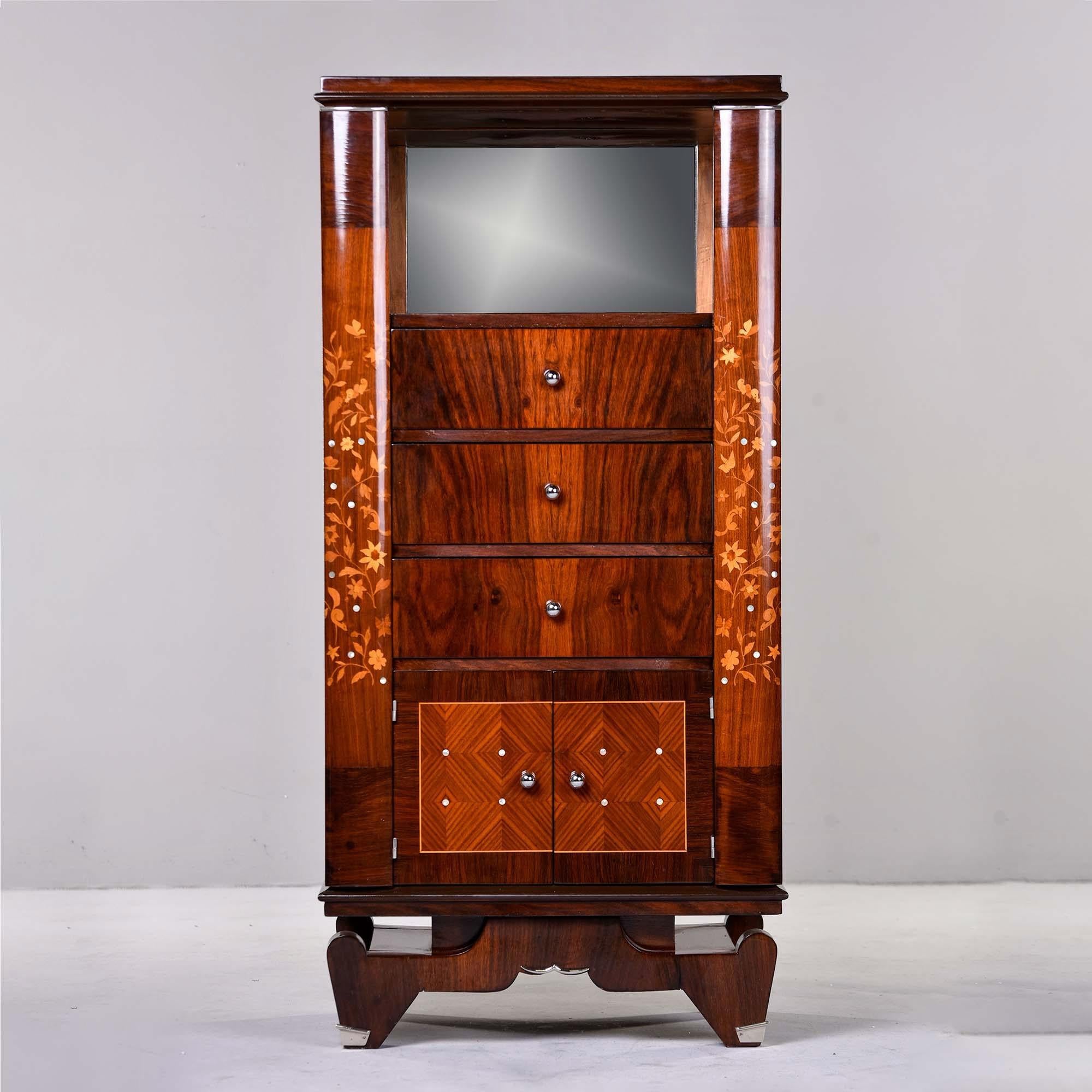 From a Paris estate, this circa 1940s tall palisandre French cabinet with extensive wood and mother of pearl inlay is attributed to Jule Leleu. Unusual to find a Deco cabinet in this size and configuration. This piece features a set in shelf at the