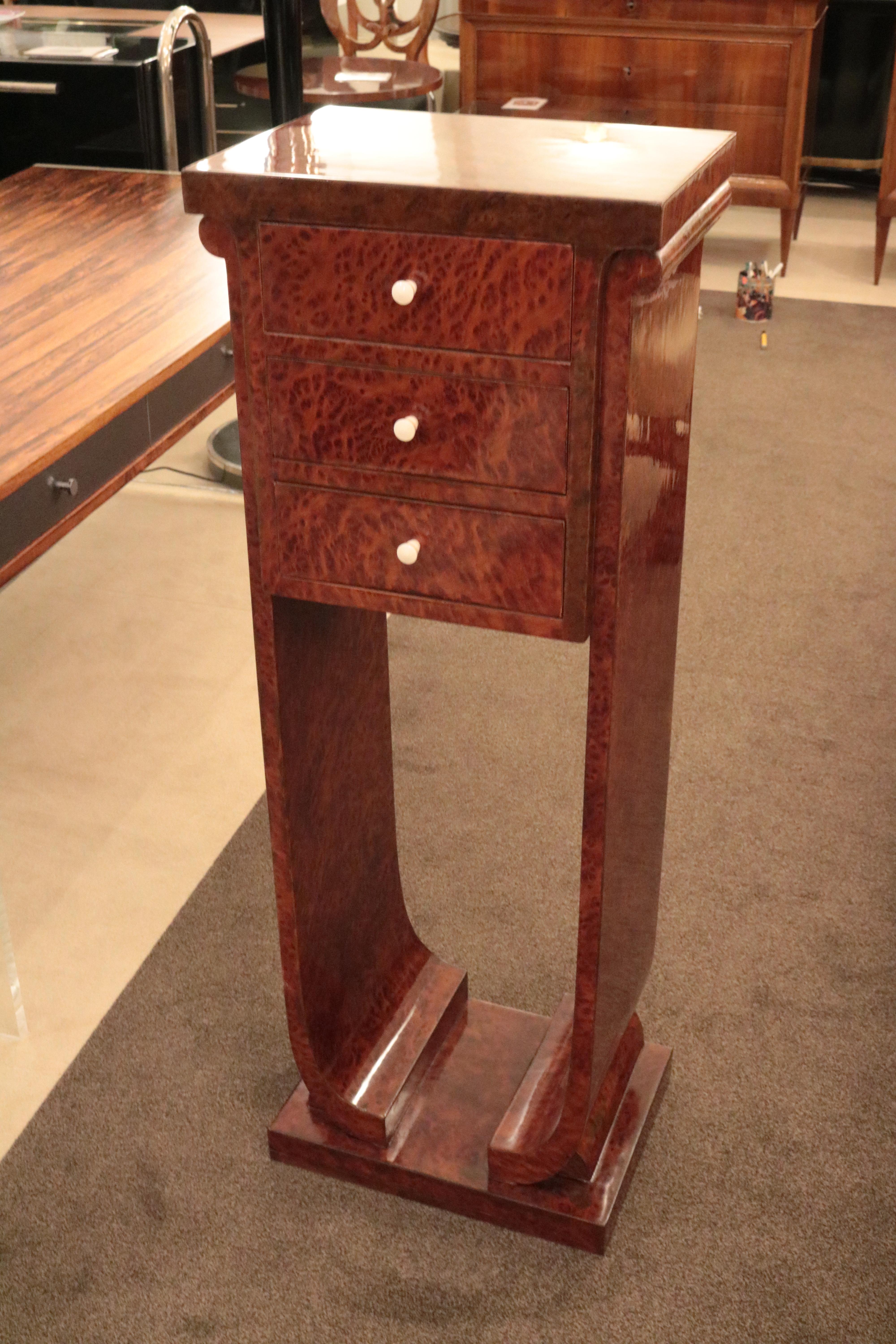 A Jules leleu designed Art Deco pedestal.
Amboyna with U shaped supports,
three small drawers.
 