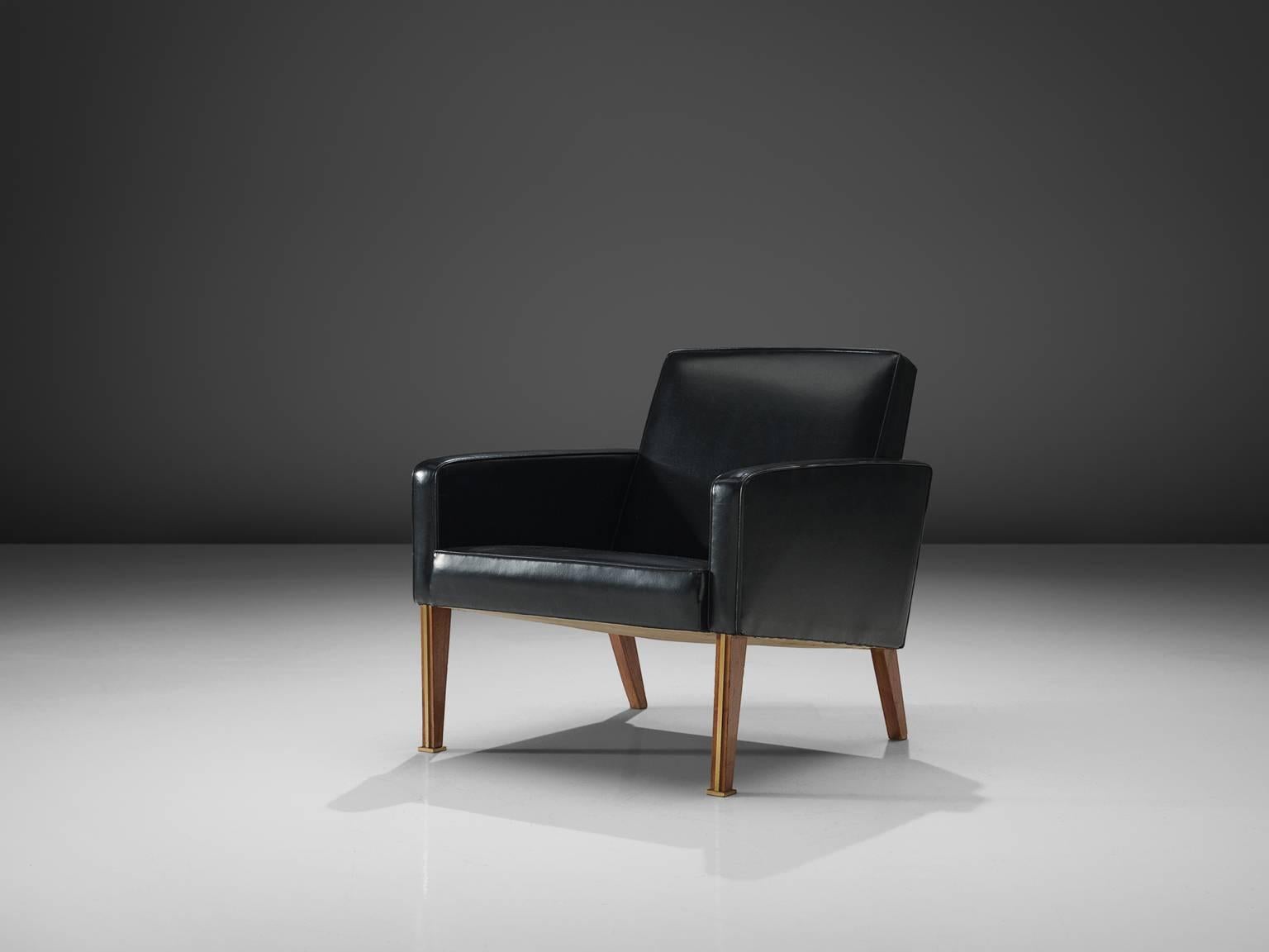Jules Leleu, armchair, black leather, wood, France, 1950s. 

This elegant lounge chair is designed by French decorator Jules Leleu. The item holds simplistic design, with stunning details. The chair is cubist with it's straight lines and angles. The