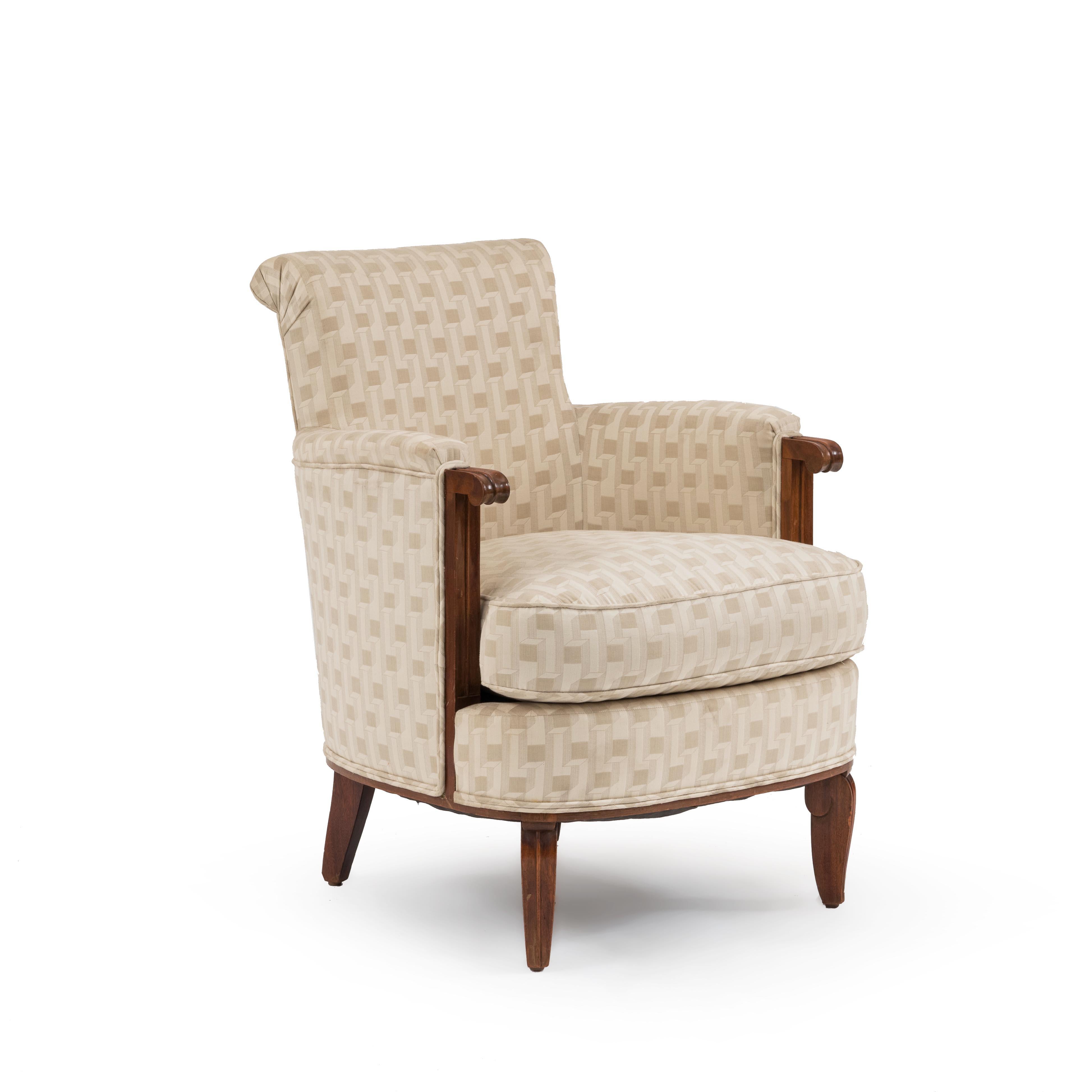 Pair of French Art Deco mahogany Bergère armchairs with beige geometric upholstery attributed to Jules Leleu.