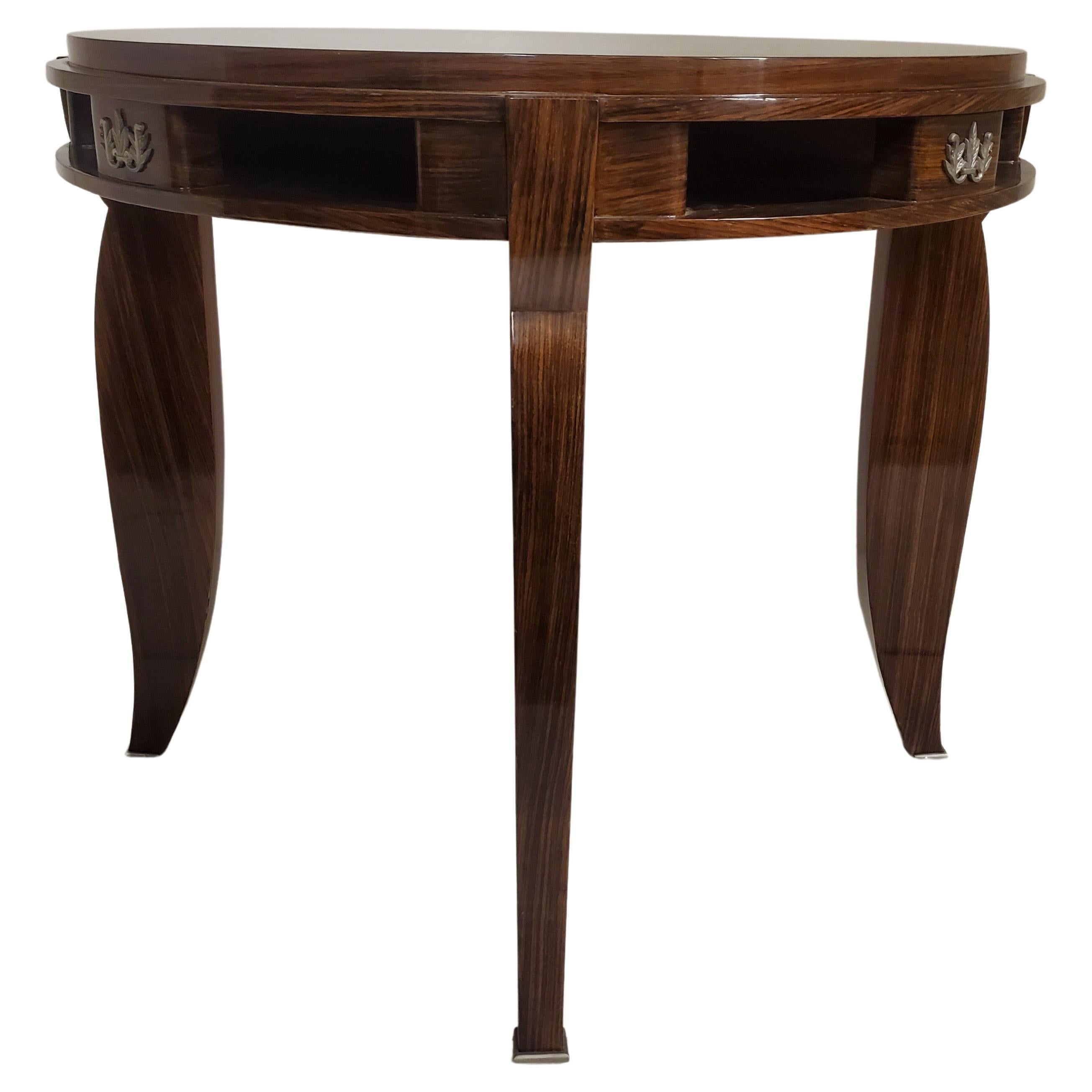 A fine Fine French Art Deco circular end/ side/ center/ card/ game / dining table attributed to the renowned designer Jules Leleu. The striking round top is inlaid with a mesmerizing parquetry pattern, meticulously crafted from the finest palisander