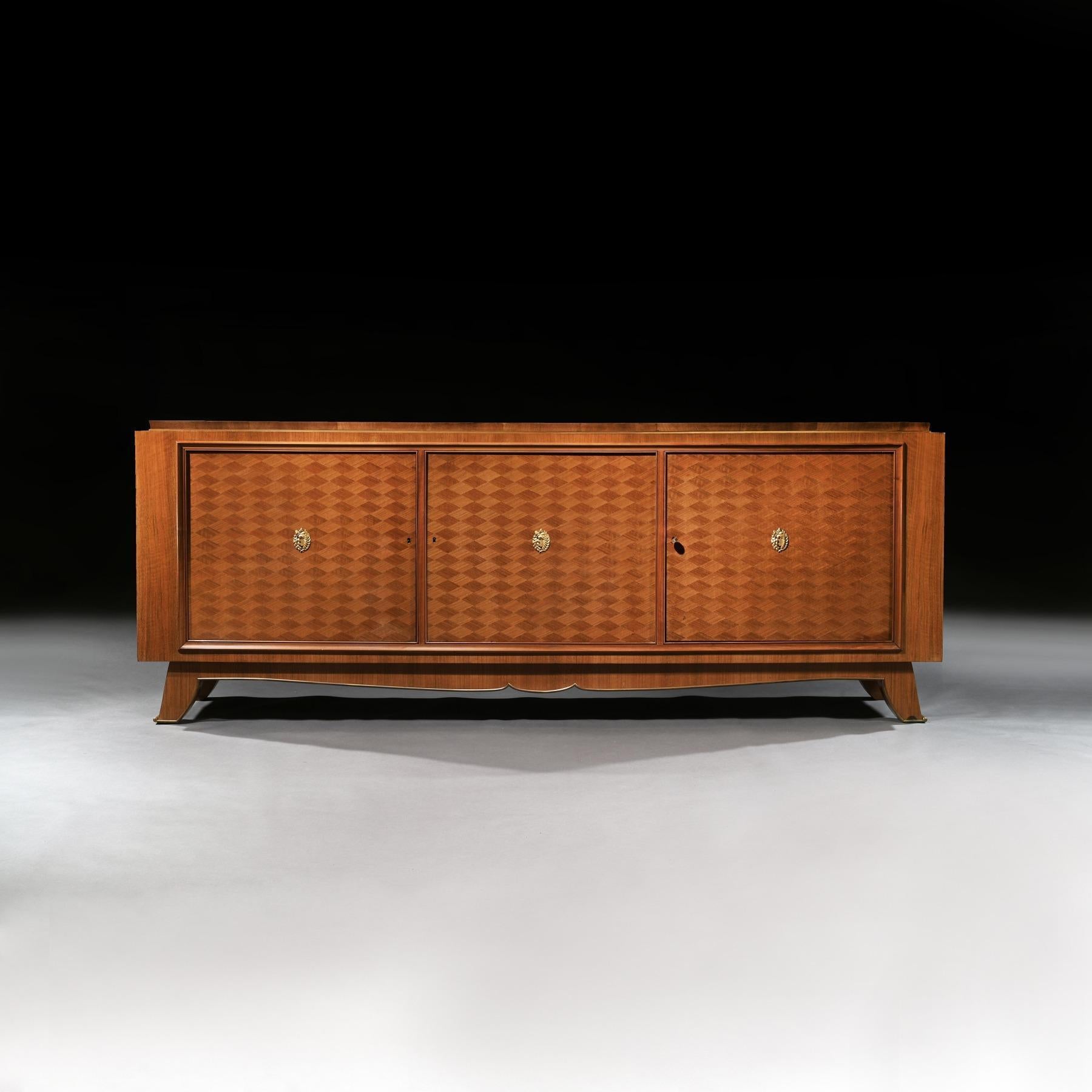 An exceptional three-door walnut and bronze French Art Deco buffet or sideboard designed and signed by Jules Leleu (1883-1961).

French - Paris, circa 1940

Extremely well constructed, as one would expect, from solid oak, veneered in European