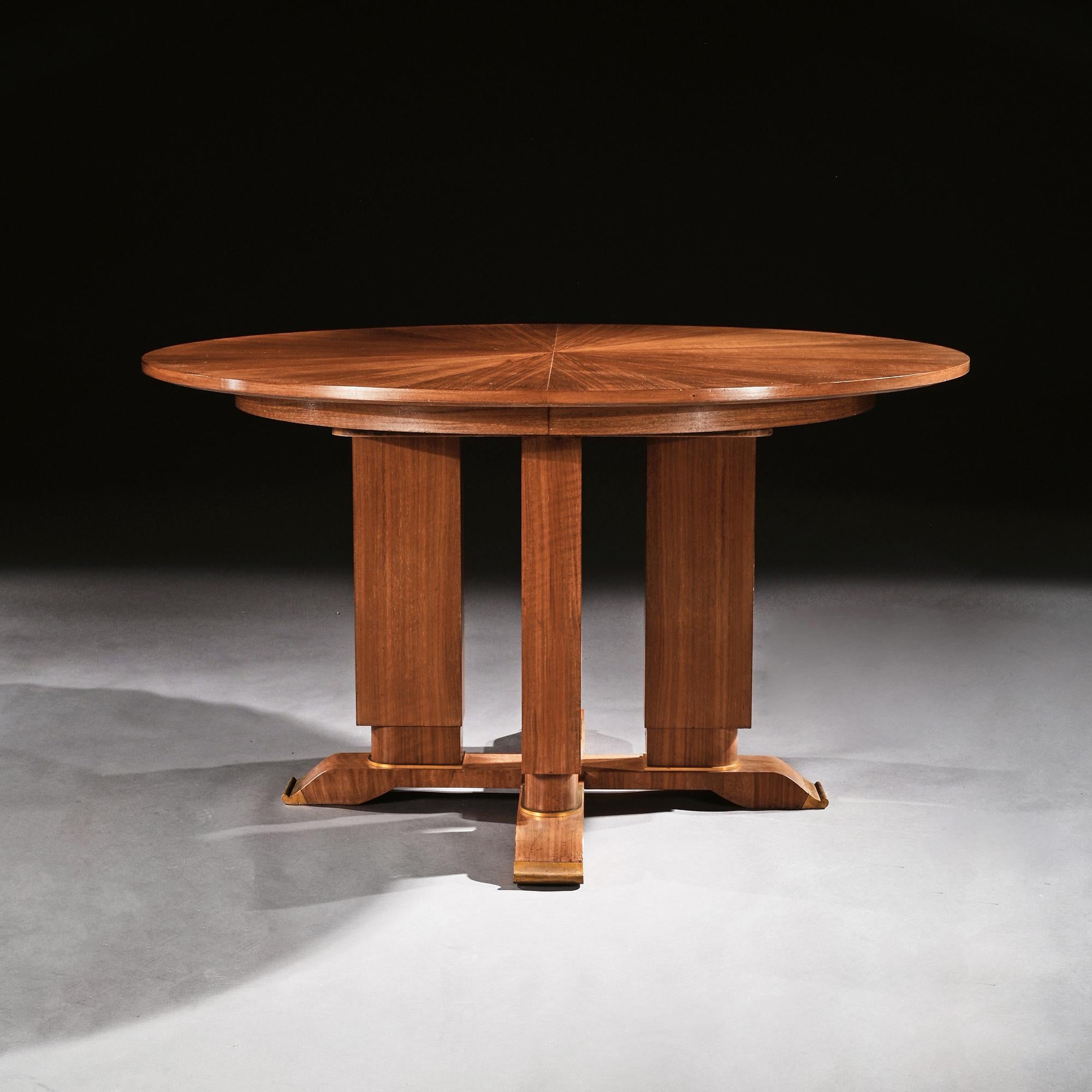 An extremely good quality and elegant French Art Deco walnut guéridon extending dining table with a stunning radiating sunburst top designed and signed by Jules Leleu. (1883-1961),
France, Paris, circa 1930
Finely constructed with choice cuts of