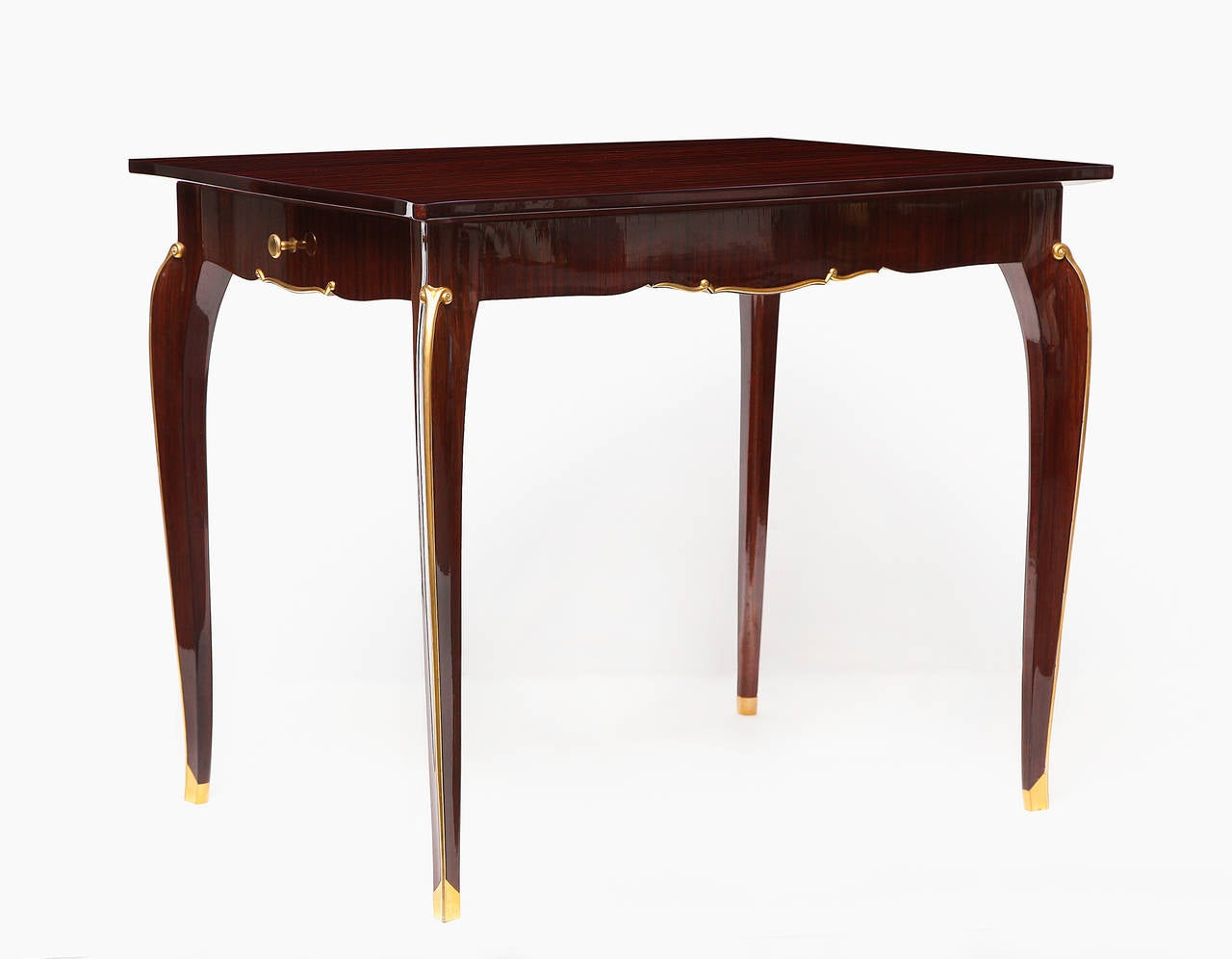 Mahogany and gilt bronze writing table with two drawers by Jules Leleu

For an illustration of an identical table, see Siriex, Françoise. The House of Leleu. New York: Hudson Hills Press, 2008. 213.
For an illustration of a similar game table,