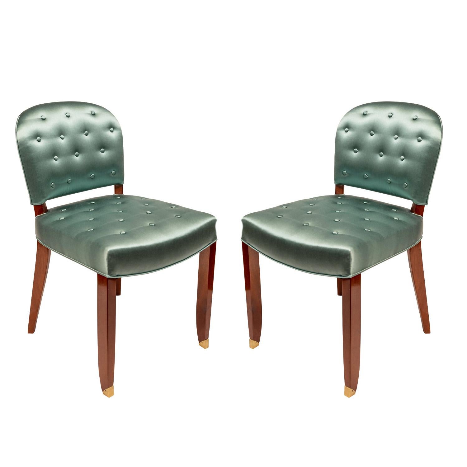 Pair of Art Deco side chairs in mahogany newly upholstered green sateen with brass sabots by Jules Leleu, France 1950's (numbered on upper legs “15467” and “15468”). These beautifully proportioned chairs are little jewels.

Reference:
The House