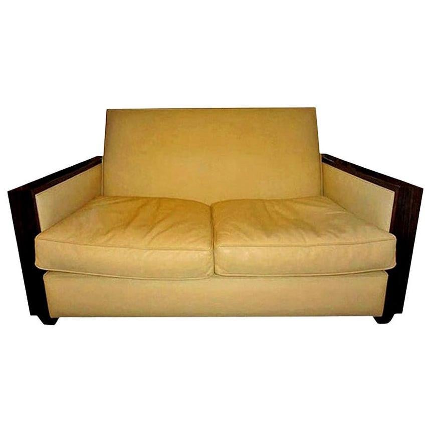 French Art Deco loveseat upholstered in leather, Jules Leleu attributed. Stunning French Art Deco geometric leather upholstered macassar loveseat, sofa or canapé in the manner of André Arbus and Émile-Jacques Ruhlmann. This comfortable clean lined