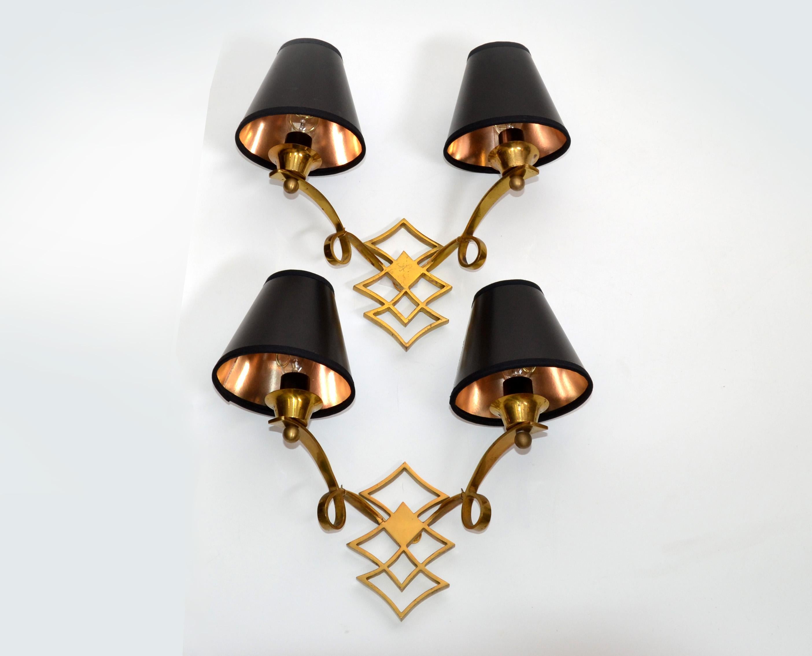 Very elegant pair of French Neoclassical brass sconces, wall lights Jules Leleu style from the 1950.
US rewiring and each sconce takes a 40 watts max light bulb, LED work too.
Sold with black & gold paper shades. 
Custom made junction box are