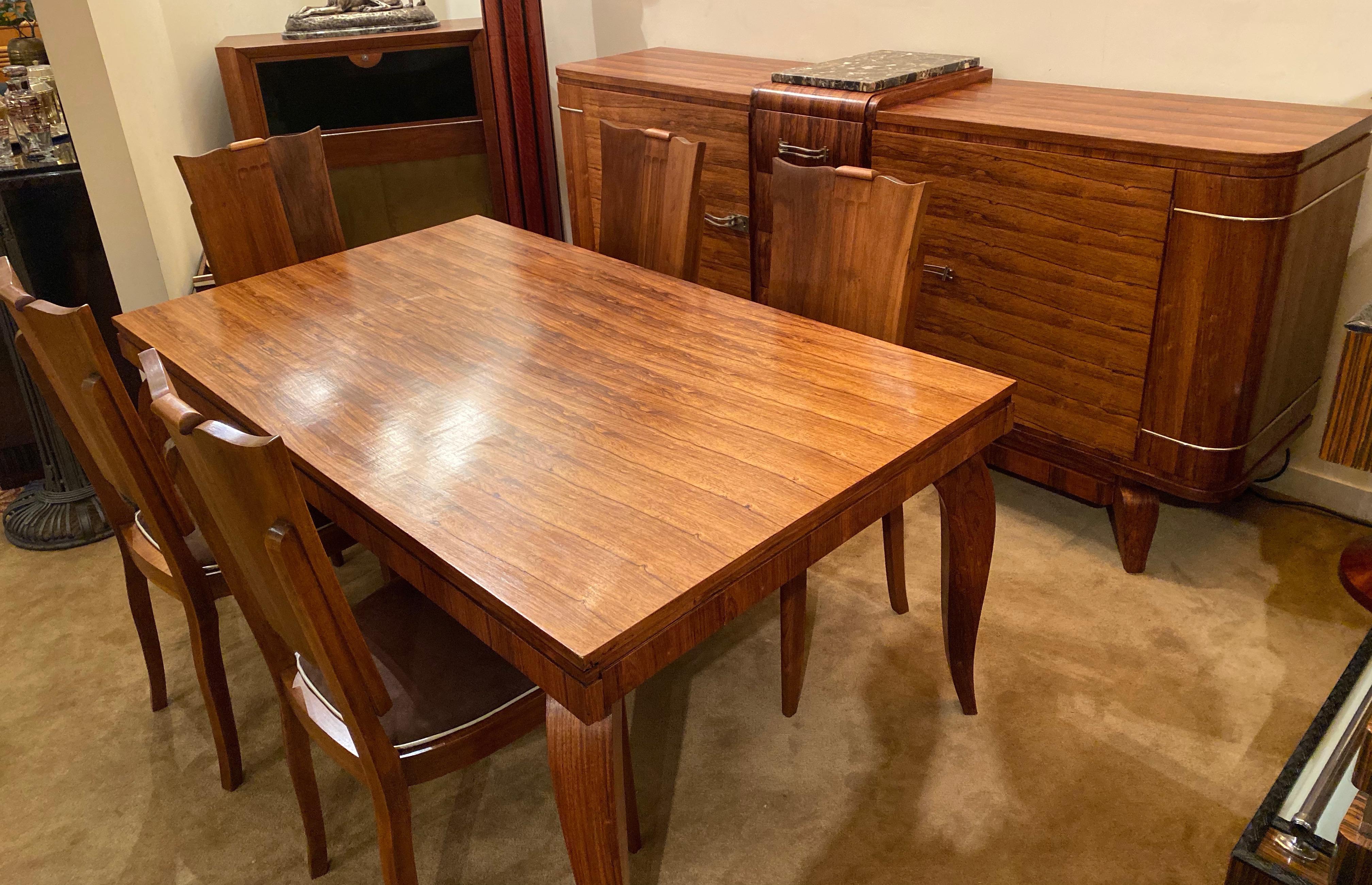 Attributed to Jule Leleu, French Art Deco dining room suite: Buffet, table and 6 chairs. Spectacular bookmatched veneers in wild vertical grain wood. Look how closely the wood grains help to create the intensity of the design, which of course
