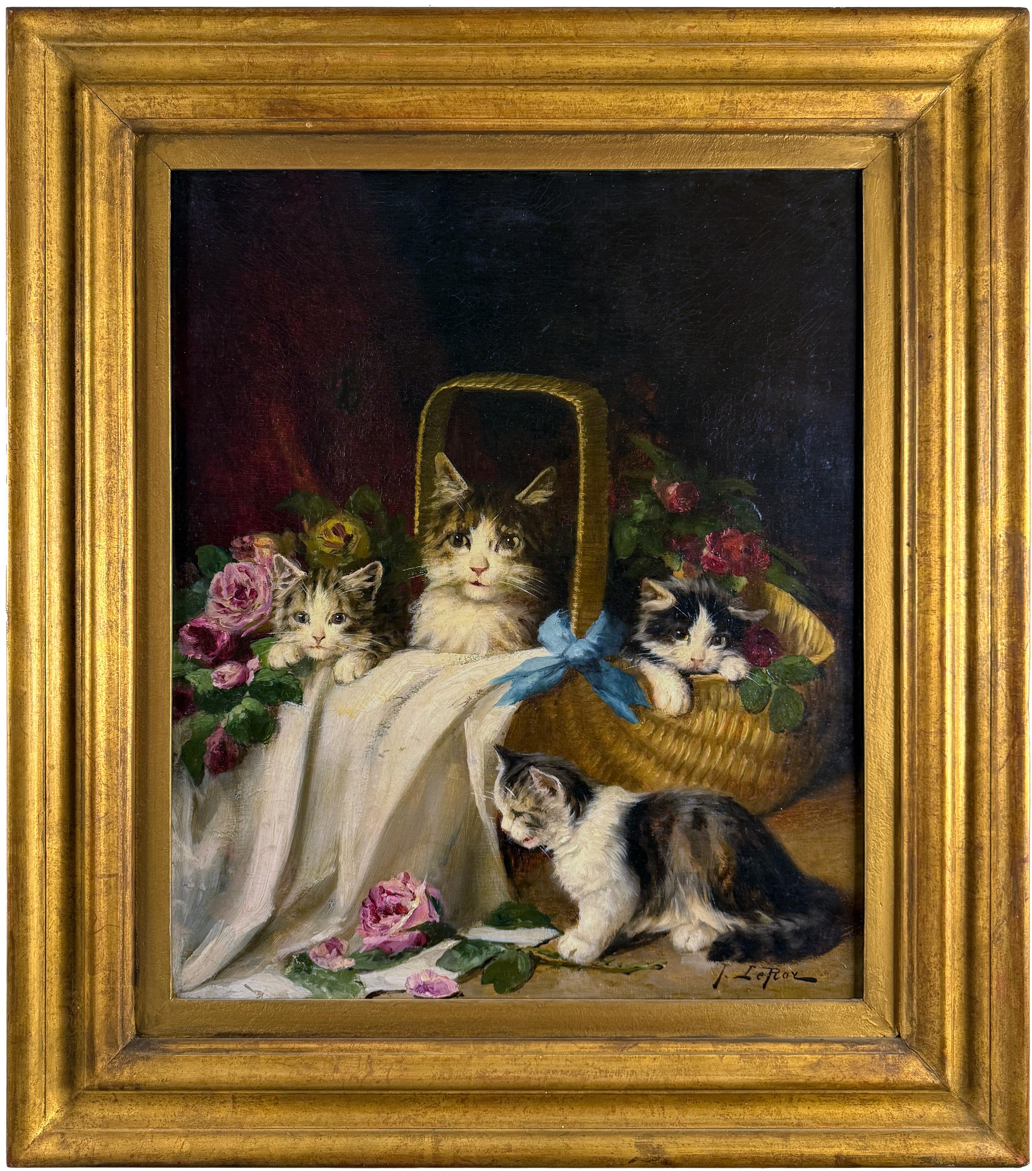 Kittens playing in a basket with roses