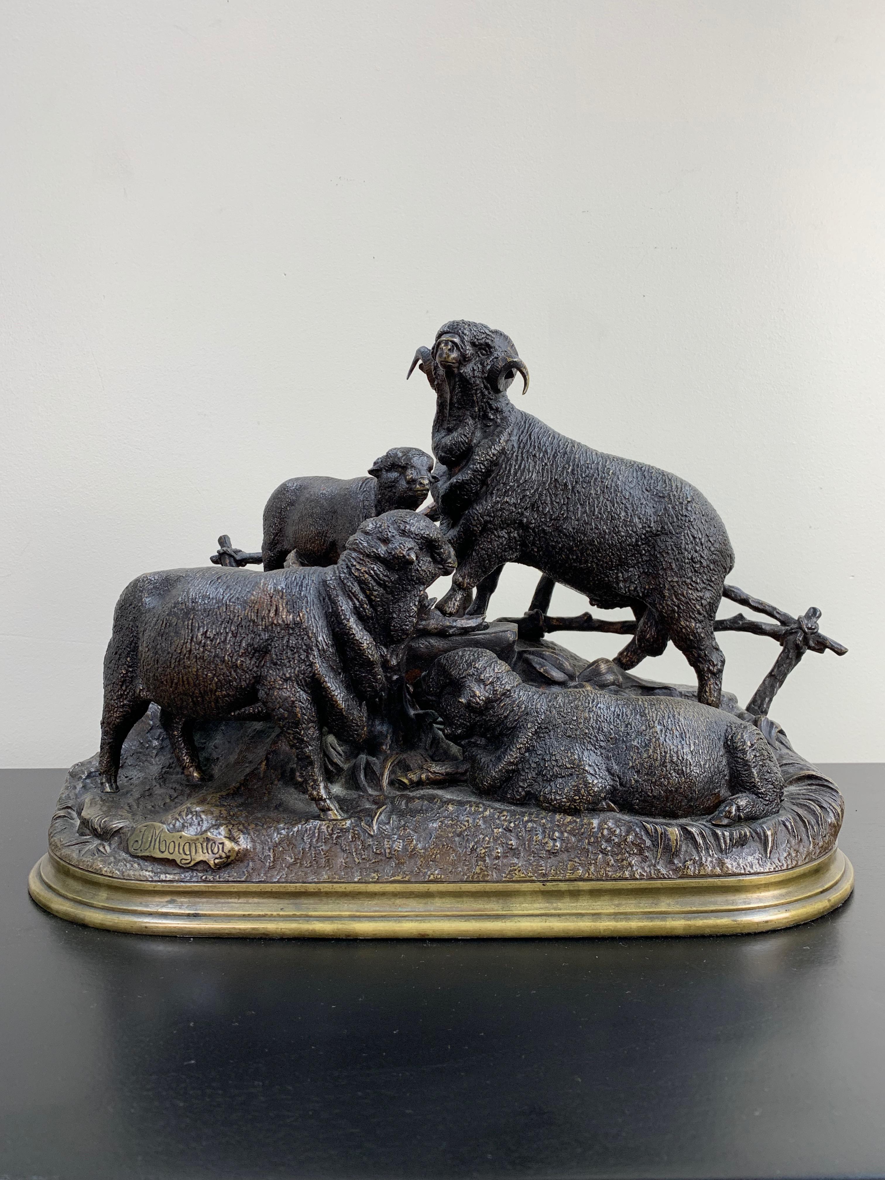 Bronze grouping of sheep with a nuanced brown patination. Moigniez' intricate work on the surface of the piece created a true-to-life rendering of the sheep's fleece. The group is set on an oval, brass base. Signed on the base: J. Moigniez.