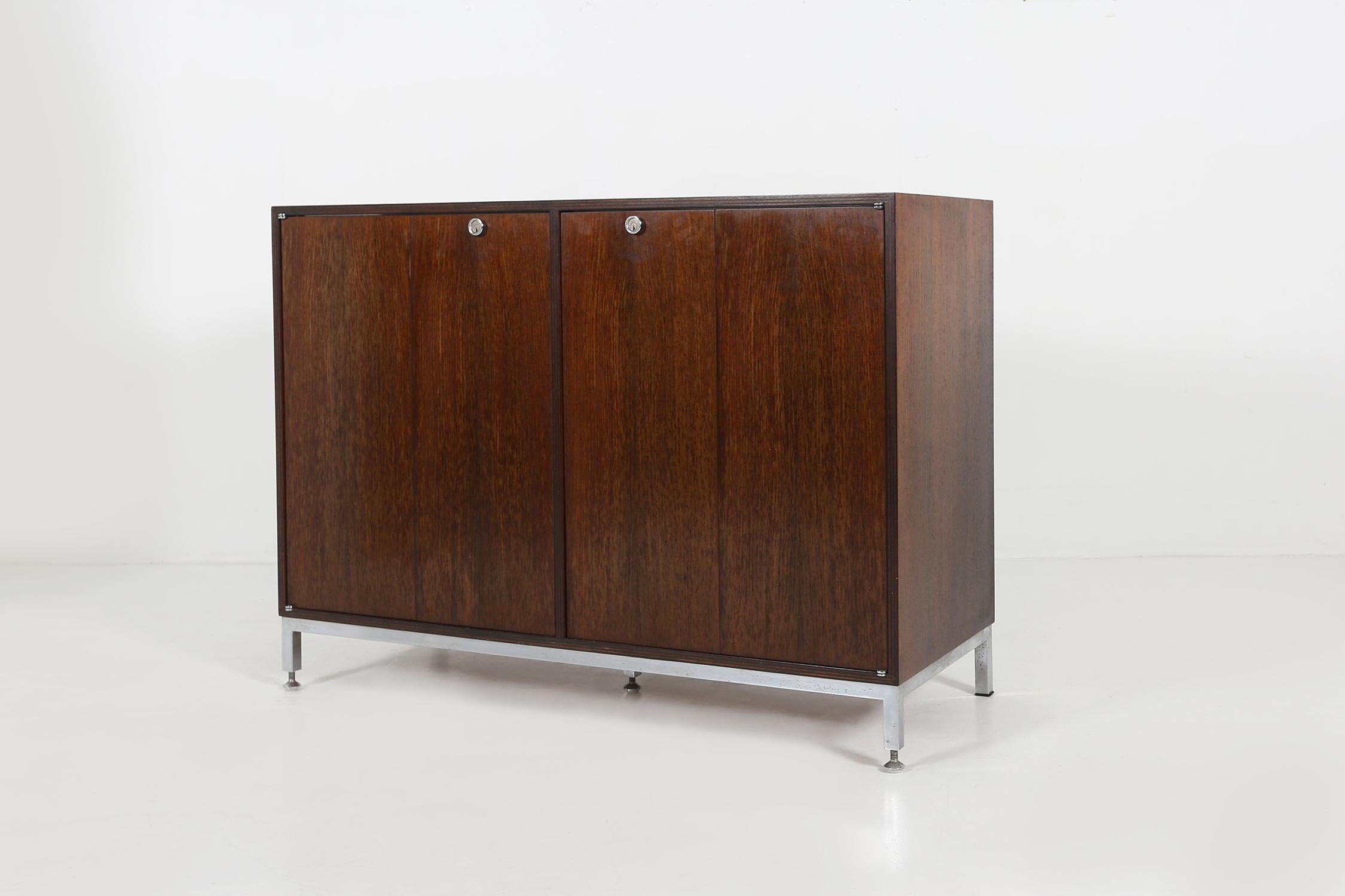 Cabinet by Jules Wabbes (Belgium) Ca.1960.
Made of Rosewood veneer and chrome metal base.
Some nice details are the butterfly doors.