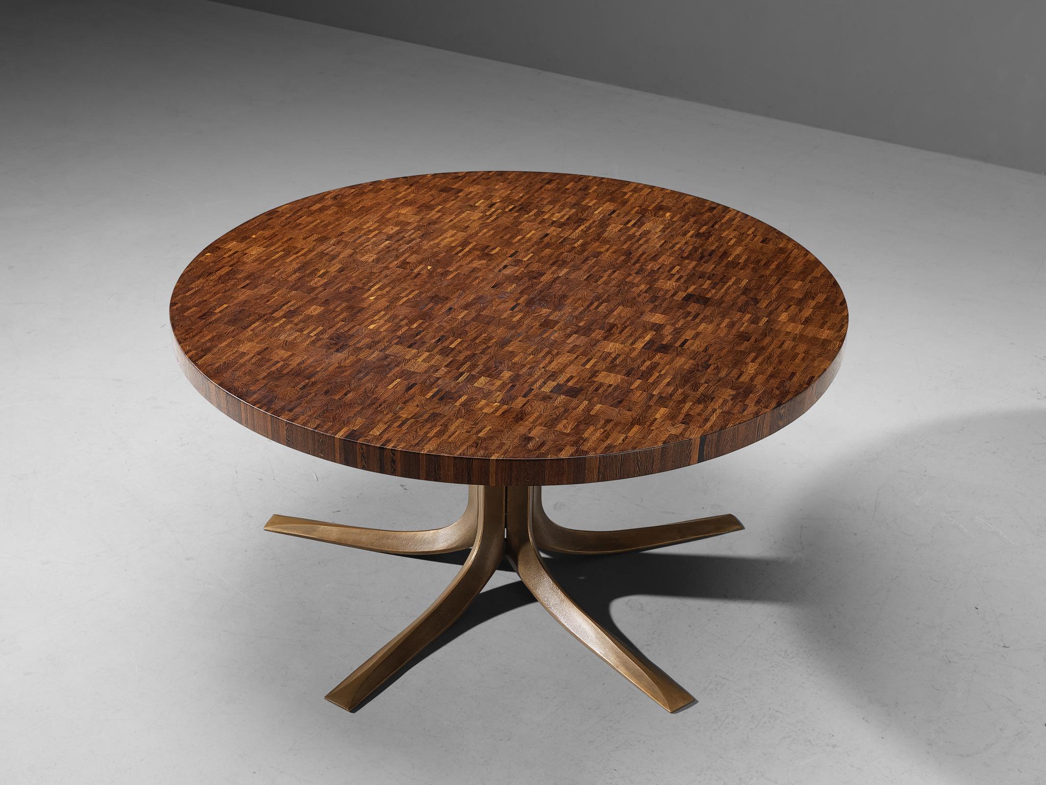 Jules Wabbes, dining table or center table, bronze, end-grain wengé, Belgium, late 1960 

Jules Wabbes created an outstanding piece of furniture that deserves a prominent place in one's living room. The tabletop owns its intricate appearance due to