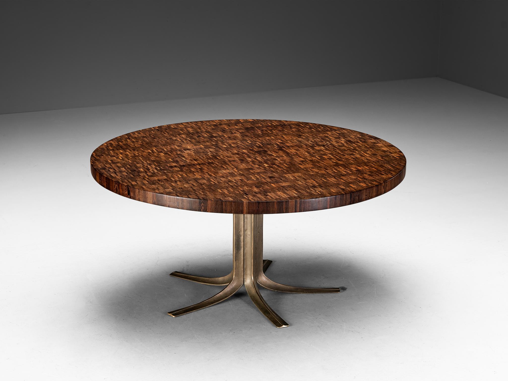 Jules Wabbes, dining table or center table, bronze, end-grain wengé, Belgium, 1960s 

Jules Wabbes created an outstanding piece of furniture that deserves a prominent place in one's living room. The tabletop owes its intricate appearance due to the
