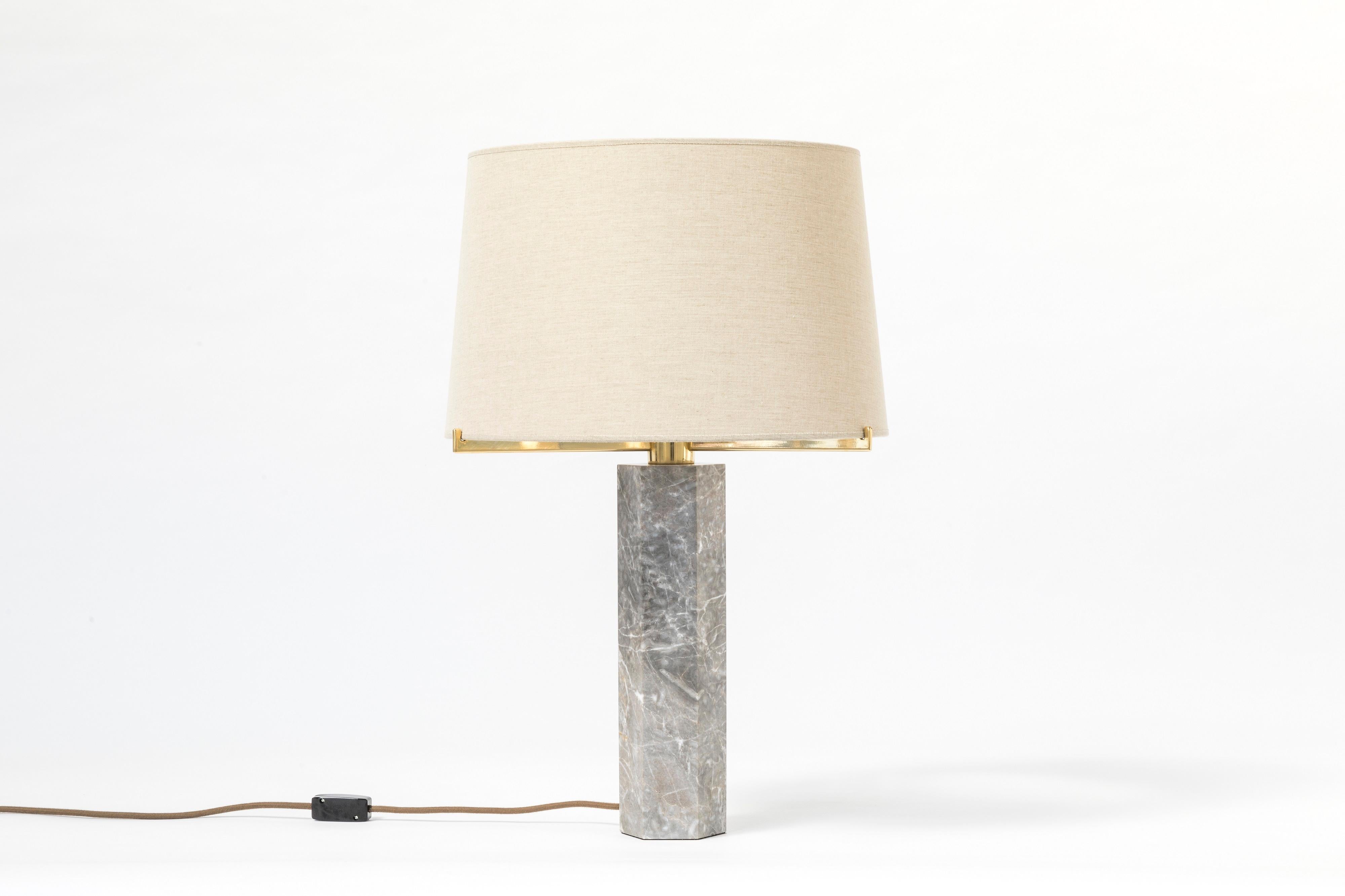 Created in the late 60s, this lamp was inspired by a stone model of the Dunbar collection designed by Edward J. Wormley in 1959. Jules Wabbes reinterpreted this classic model. The first copies made of travertine were produced by Mobilier Universel.