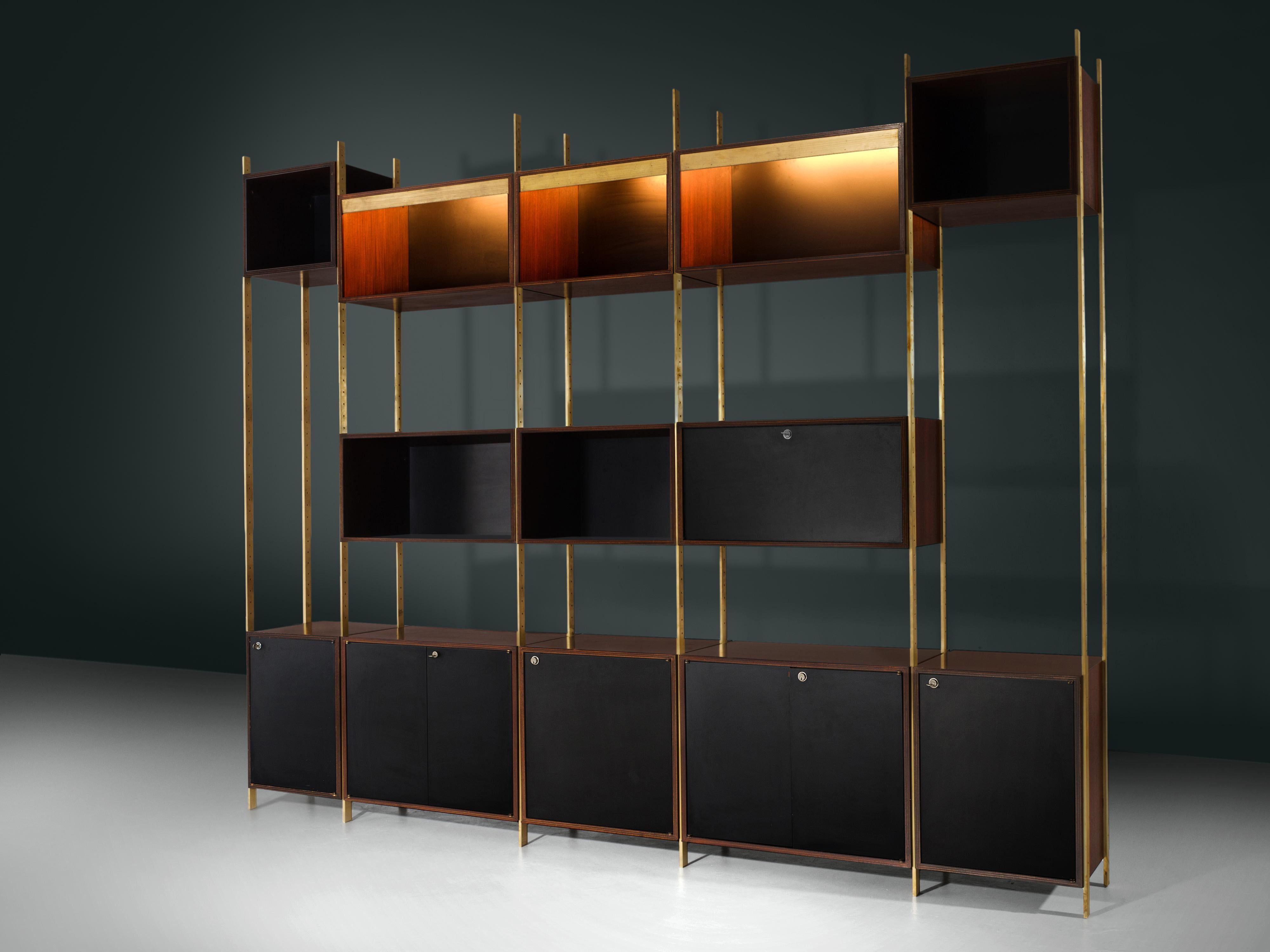 Jules Wabbes for Mobilier Universel, bookcase, in brass and rosewood, Belgium, 1960s
 
Rare wall unit designed by master furniture-maker Jules Wabbes. This exceptional piece could be used as a bookcase infront of a wall or a room divider. The