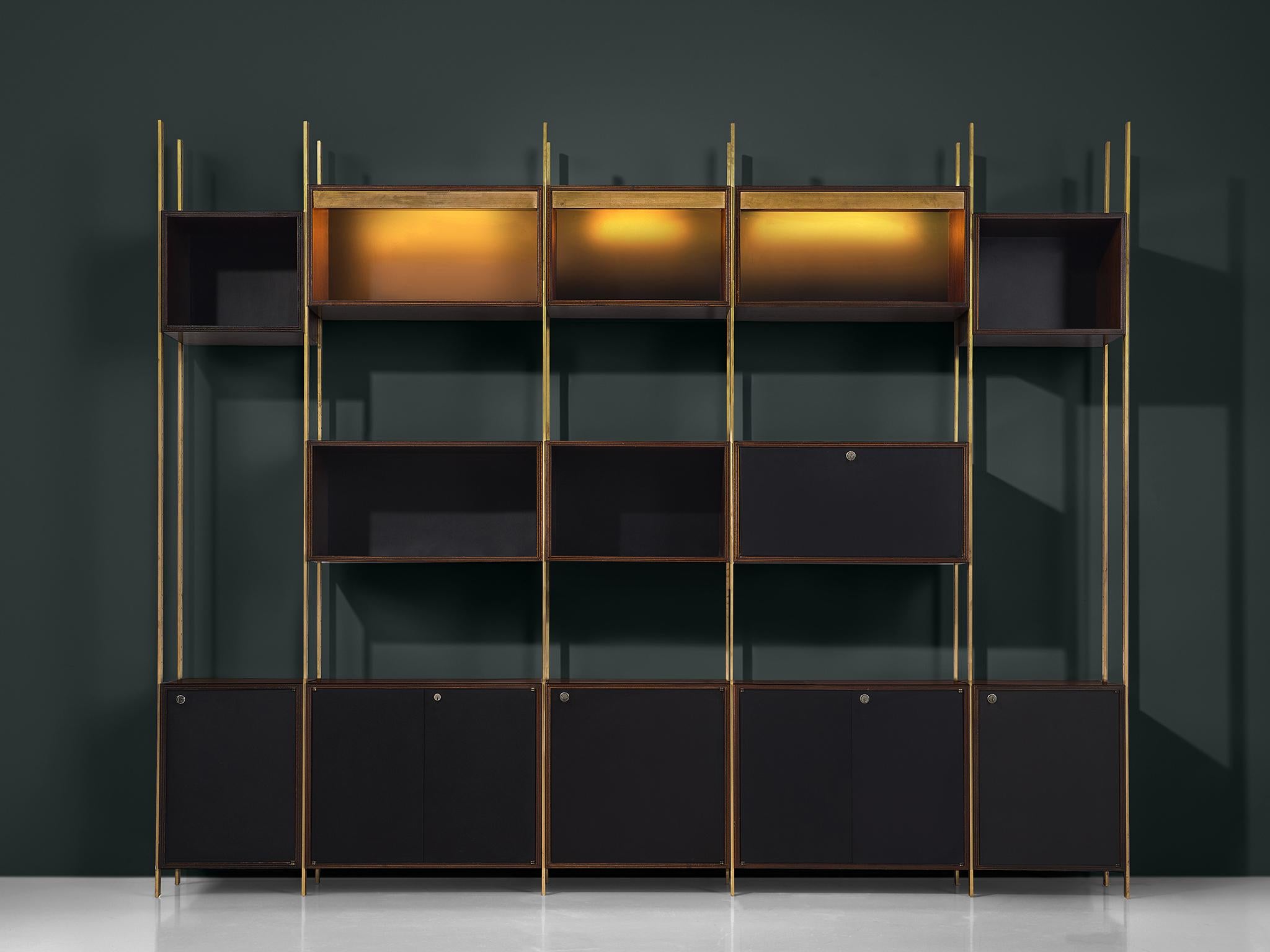 Jules Wabbes for Mobilier Universel, bookcase, in brass and rosewood, Belgium, 1960s.
 
Rare wall unit designed with the highest precision in furniture making by master furniture-maker Jules Wabbes. This exceptional piece could be used as a