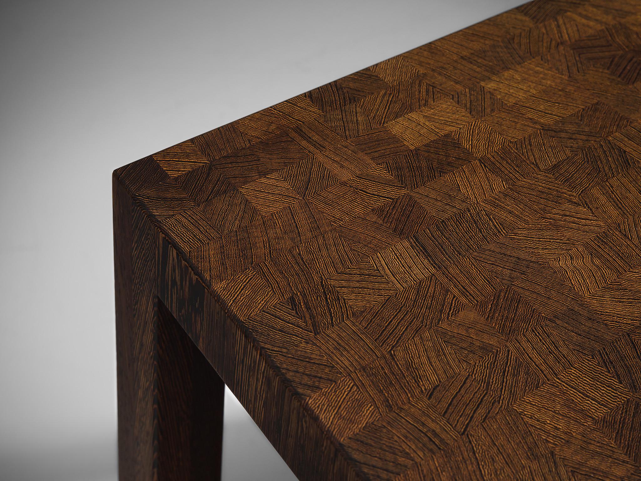 Jules Wabbes, side table, wengé, Belgium, circa 1961

Unique square coffee table with end grain wooden top in wengé. The wengé squares are creating a vibrant and geometric appearance in the warm color of the wood. The table is executed with two