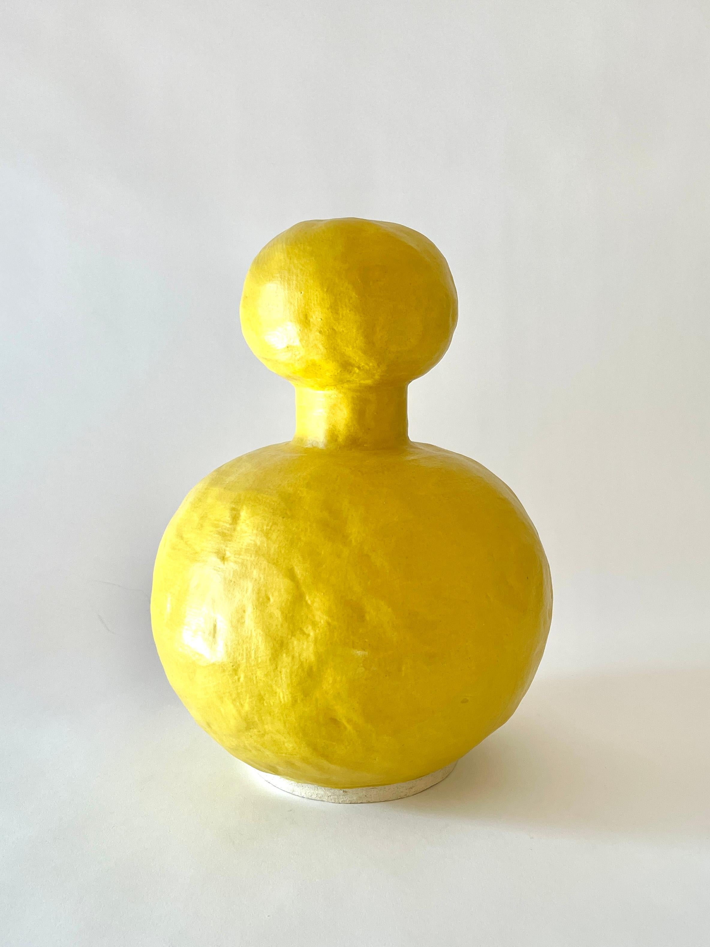 Jules Yellow vase by Meg Morrison
Materials: Ceramic.
Dimensions: Ø 23 x H 32 cm.

Available in Black, White, Yellow and Pink finishes. All sizes are approximate. Although vases are watertight condensation may form on the bottom. Please protect