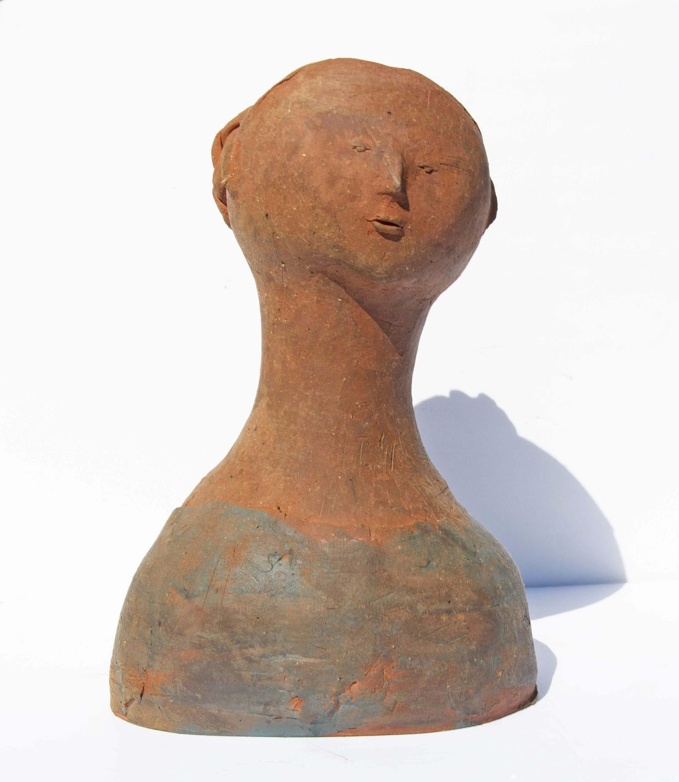 Delicate sculpted bust of a woman. Perhaps a ballerina. Sculpture by ceramicist Julia Browne. Julia graduated from the American Craftsman Studio at Rochester Institute of Technology  in 1960. This bust was a gift to her benefactor Evelyn Buff Segal